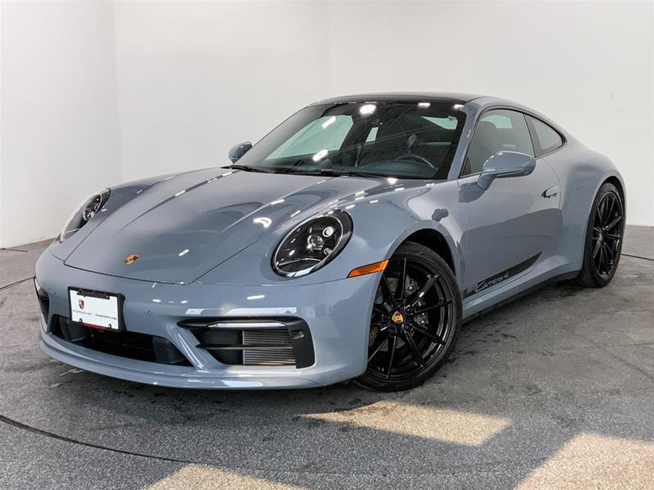 Highly Equipped with Sport Package, Premium Package, Sport Chrono Package, Burmester High-End Surround Sound System, Porsche Torque Vectoring Plus (PTV+), Sport Exhaust System with High-Gloss Black Tailpipes, 18-Way Adaptive Sport Seats with Memory Package, Surround View, Lane Change Assist (LCA), Ventilated Front Seats and much more! 2023 Porsche 911 Carrera 4 Coupe (992) is finished in Arctic Grey with a Graphite Blue Leather Interior featuring Chalk Stitching! This Local BC Vehicle has No Reported Accidents or Claims! We Accept All Trade-Ins and Buy-Ins!! This vehicle is a Porsche Approved Certified Pre-Owned Vehicle: 2 extra years of unlimited mileage warranty plus an additional 2 years of Porsche Roadside Assistance. All CPO vehicles have passed our rigorous 111-point check and reconditioned with 100% genuine Porsche parts. For more details or to schedule a test drive with one of our highly trained sales executives, please send us a website inquiry before it&rsquo;s gone. Porsche Centre Langley has proudly earned the Porsche Premier Dealer Award eight years in a row. Conveniently located just off Highway 1 in Langley, British Columbia, we are committed to helping you find and drive your dream vehicle. Please note: A $599 documentation fee and a $690 dealer preparation fee apply to all pre-owned vehicles. Dealer #40136.