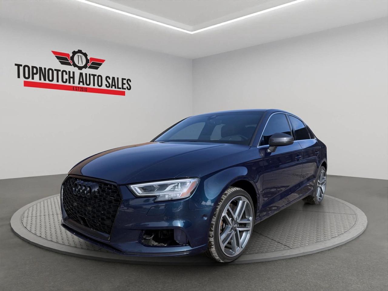 <h2>2019 Audi A3 Quattro Technik 45 TFSI</h2><p><br></p><p><strong>Now Available at Topnotch Auto Sales Inc</strong></p><p><br></p><p>Discover the perfect blend of sporty performance, advanced German engineering, and premium luxury with the 2019 Audi A3 Quattro Technik 45 TFSI. This sophisticated compact sedan impresses with its sleek, aerodynamic design and a full suite of high-end features, making it an exceptional choice for drivers seeking style, power, and comfort. Whether youre navigating city streets or hitting the open highway, the Audi A3s dynamic capability and refined craftsmanship deliver a truly elevated driving experience. With Audis renowned Quattro all-wheel drive system and cutting-edge technology, this vehicle offers unparalleled confidence, versatility, and everyday practicality for discerning drivers.</p><p><br></p><p><br></p><h2>Performance & Capability</h2><p><br></p><p>The 2019 Audi A3 Technik 45 TFSI is equipped with a robust turbocharged engine, seamlessly paired with a responsive automatic transmission to provide exhilarating acceleration and agile handling. Audis legendary Quattro all-wheel drive system ensures outstanding traction and control in any weather condition, delivering both stability and excitement behind the wheel. Enjoy precise steering, a composed ride, and impressive fuel efficiency, making this sedan ideal for both spirited drives and daily commutes.</p><p><br></p><p><br></p><h2>Interior Comfort & Features</h2><p><br></p><p>Step into a luxurious, meticulously crafted cabin where every detail reflects Audis commitment to quality. The interior of the A3 offers:</p><p><br></p><ul><li><br></li><li>Seating for up to five passengers with high-grade premium upholstery for maximum comfort</li><li><br></li><li>Power-adjustable front seats with convenient driver memory functions for personalized support</li><li><br></li><li>Dual-zone automatic climate control for a tailored, comfortable environment year-round</li><li><br></li><li>Power windows, door locks, and heated side mirrors for enhanced convenience</li><li><br></li><li>Spacious trunk and versatile storage compartments to accommodate all your cargo needs</li><li><br></li><li>Elegant aluminum inlays and refined interior finishes for an upscale, modern ambiance</li><li><br></li></ul><p><br></p><p>The Audi A3s thoughtfully designed interior perfectly combines sophistication, comfort, and smart functionality for every journey.</p><p><br></p><p><br></p><h2>Technology & Connectivity</h2><p><br></p><p>Stay seamlessly connected and entertained with Audis innovative technology package, featuring:</p><p><br></p><ul><li><br></li><li>Audi MMI infotainment system with an intuitive, high-resolution display</li><li><br></li><li>Virtual Cockpit digital instrument cluster providing customizable driver information</li><li><br></li><li>Bluetooth hands-free connectivity for safe calling and audio streaming</li><li><br></li><li>USB ports for easy device charging and media integration</li><li><br></li><li>Steering-wheel-mounted controls allowing you to manage features safely on the go</li><li><br></li><li>Premium audio system delivering dynamic, crystal-clear sound throughout the cabin</li><li><br></li></ul><p><br></p><p>With its advanced suite of infotainment and connectivity options, the A3 ensures you and your passengers enjoy every drive to the fullest.</p><p><br></p><p><br></p><h2>Safety & Peace of Mind</h2><p><br></p><p>Engineered with a focus on driver and passenger safety, the 2019 Audi A3 Quattro Technik is equipped with advanced protective features, including:</p><p><br></p><ul><li><br></li><li>Rearview camera for added confidence when reversing or parking</li><li><br></li><li>Quattro all-wheel drive for superior control and stability</li><li><br></li><li>Electronic stability control and advanced traction management</li><li><br></li><li>Anti-lock braking system (ABS) for reliable stopping power</li><li><br></li><li>Multiple strategically placed airbags to protect all occupants</li><li><br></li><li>Tire pressure monitoring system for additional safety on the road</li><li><br></li></ul><p><br></p><p>Drive with complete peace of mind, knowing your Audi A3 is engineered with advanced safety systems designed to keep you secure at all times.</p><p><br></p><p><br></p><h2>Vehicle Condition</h2><p><br></p><p>This 2019 Audi A3 Quattro Technik 45 TFSI is presented in excellent, non-smoking condition inside and out. Professionally detailed and thoroughly inspected, it reflects meticulous care and pride of ownership, making it ready for its next discerning driver.</p><p><br></p><p><br></p><h2>Why Choose Topnotch Auto Sales?</h2><p><br></p><p>At Topnotch Auto Sales Inc, we are committed to offering hand-selected, premium pre-owned vehicles along with exceptional customer service. Our experienced and knowledgeable team is dedicated to ensuring that every client enjoys a smooth, transparent, and stress-free vehicle purchase experience from start to finish.</p><p><br></p><p><br></p><h2>Flexible Financing Solutions</h2><p><br></p><p>We provide quick and easy financing approvals for <strong>all credit situations</strong>, including those with bad credit, no credit, new credit, or prior repossessions. Take advantage of our flexible financing options, including low down payments and same-day approvals designed to fit your budget.</p><p><br></p><p><br></p><h2>Certification Option</h2><p><br></p><p>For added peace of mind, choose to certify this 2019 Audi A3 Quattro Technik 45 TFSI for <strong>just $799</strong>. This ensures the vehicle meets all Ontario safety standards, delivering extra confidence with your purchase.</p><p><br></p><p><br></p><h2>OMVIC Compliance</h2><p><br></p><p><strong>Please Note:</strong> Any uncertified vehicles are sold asis and must be certified prior to road use, as required by OMVIC regulations. Our team is happy to assist in completing the certification process for you.</p><p><br></p><p><br></p><p>With over <strong>14 years of automotive industry expertise</strong>, Topnotch Auto Sales Inc is proud to be a trusted destination for quality luxury vehicles in <strong>{location}</strong>, known for honesty, integrity, and a strong commitment to customer satisfaction.</p><p><br></p><p><br></p><p> <strong>Visit Us At:</strong></p><p><br></p><p>5455 Steeles Ave W, North York, ON M9L 1S7</p><p><br></p><p> <strong>Call or Text:</strong></p><p><br></p><p>416-879-7113</p>