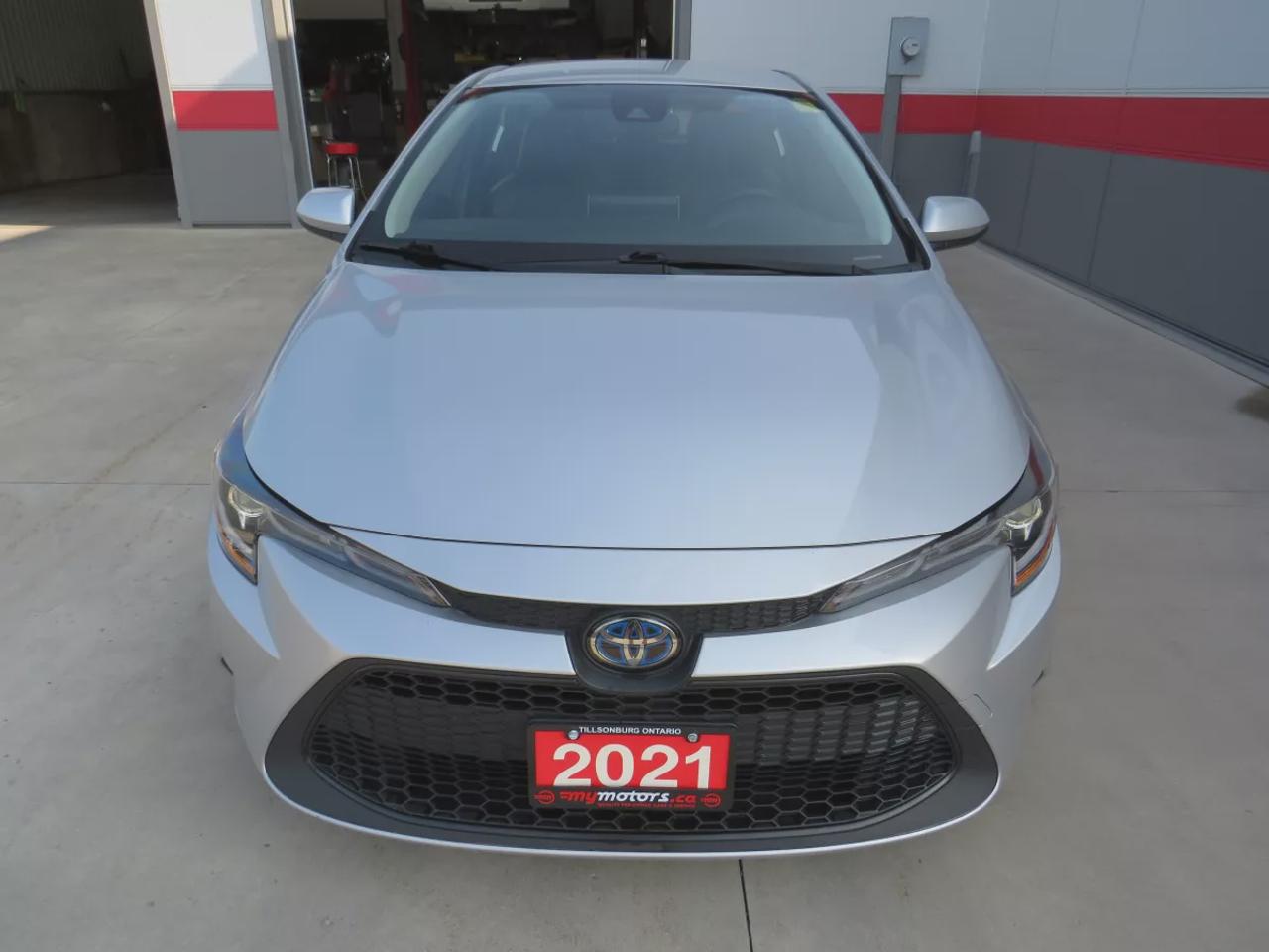 2021 Toyota Corolla Hybrid  | Very Low Km | Clean Title | No Accidents | Safety Certified | Hybrid | Leather | Wireless Phone Charging | Push Button Start | Power Seats | Reverse Camera | Digital Touchscreen | Drive Modes | Heated Seats | Digital Climate Control Photo