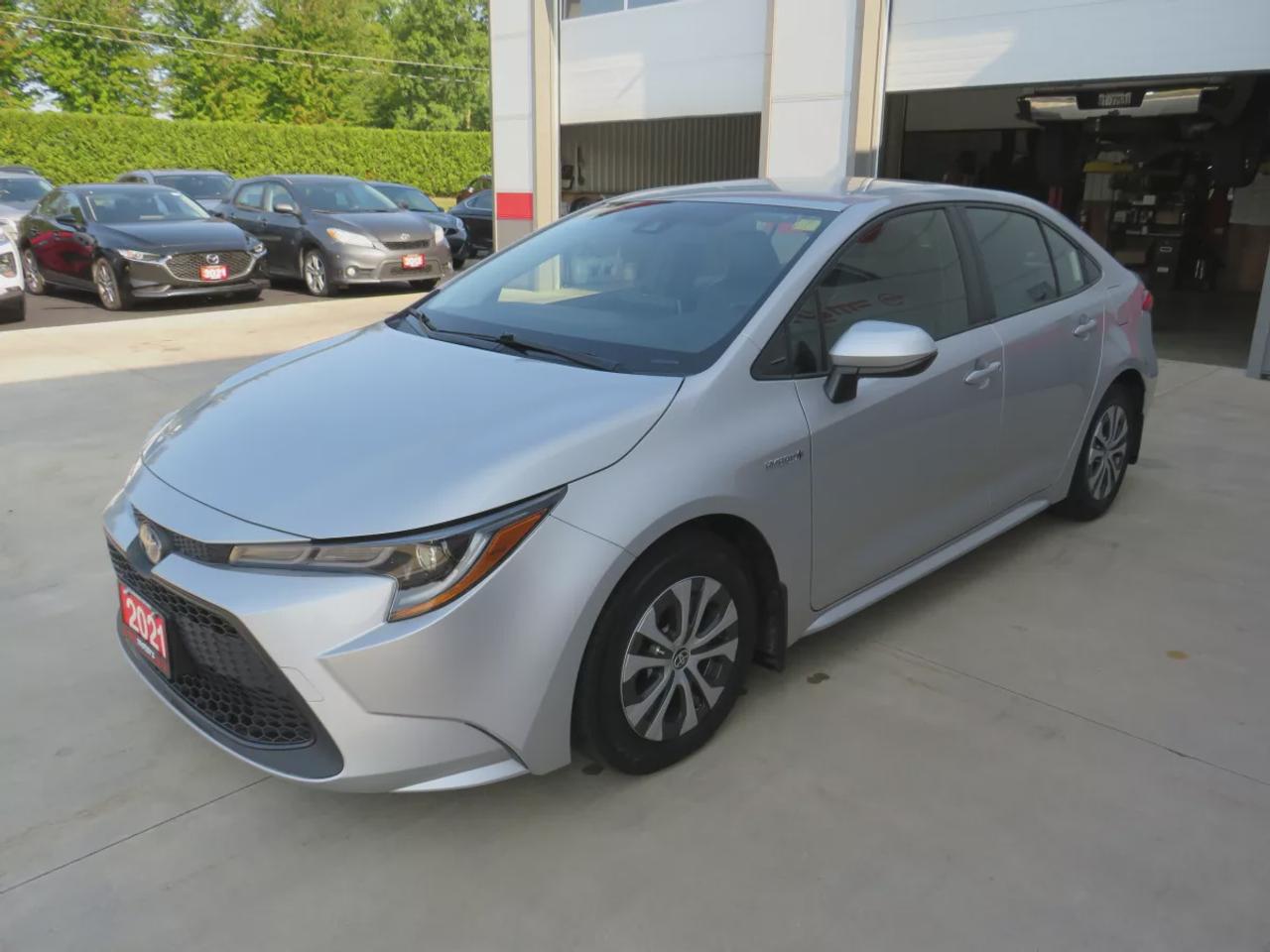 2021 Toyota Corolla Hybrid  | Very Low Km | Clean Title | No Accidents | Safety Certified | Hybrid | Leather | Wireless Phone Charging | Push Button Start | Power Seats | Reverse Camera | Digital Touchscreen | Drive Modes | Heated Seats | Digital Climate Control Photo