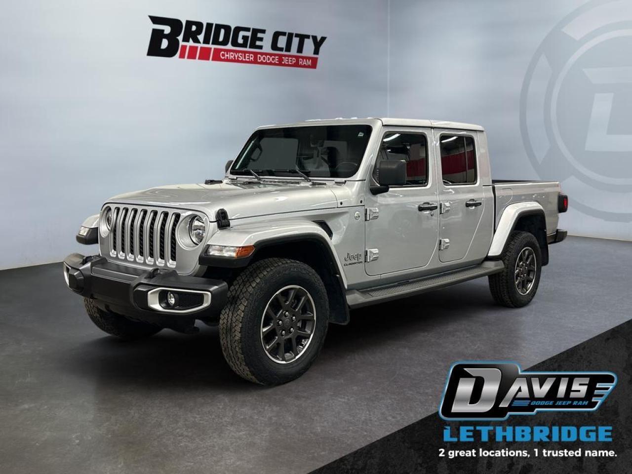 <b>3.6L V6 - Leather - Tow Pkg - Navigation - Box Liner - Remote Start - Heated Seats & Steering Wheel - Trail Rated 4x4 <br /> <br /></b><br /> This Jeep Gladiator is ready to change the game of utility vehicles and pickup trucks. This 2022 Jeep Gladiator is for sale today in Lethbridge. <br /> <br />Built with unmistakable Jeep styling and off-road capability, while bringing the utility and hauling power of a pickup truck, you get the best of both worlds with this incredible machine. Thanks to its unmistakable style, rugged off-road technology, and an exhilarating open air truck experience, this unique Jeep Gladiator is ready to change the 4X4 game. This low mileage Regular Cab 4X4 pickup has just 33,884 km. Stock number 40522 is Silver in colour. It has an Automatic transmission and is powered by a 285HP 3.6L V6 Cylinder Engine. <br /> <br /> Our Gladiator's trim level is Overland. With convenient and stylish side steps, a beautiful hard top, proximity keys for hands free entry, and Overland logos throughout, this Overland trim is dressed to impress. This Gladiator takes infotainment just as seriously as the trail with navigation, a premium Alpine audio system, Apple CarPlay, Android Auto, and a wi-fi hotspot offered on the Uconnect system. This truck is exactly what you want from an off-roading machine with skid plates, tow hooks, a sport bar, Dana axles, and a shift-on-the-fly transfer case while aluminum wheels make sure you do it in style. A rearview camera and fog lamps help you stay safe. This vehicle has been upgraded with the following features: Navigation, Premium Audio, Android Auto, Apple CarPlay, 4G Wi-Fi, Aluminum Wheels, Rear Camera.<br /> <br />To apply right now for financing use this link: <a href=https://www.bridgecitychrysler.com/pre-approval/ target=_blank rel=nofollow noopener noreferrer>https://www.bridgecitychrysler.com/pre-approval/</a><br /><br /> <br /><br />Locally Owned & Trusted for Over 35 Years  Bridge City Chrysler in Lethbridge, AB <br /><br /> At Bridge City Chrysler, weve proudly served the Lethbridge community for more than 35 years, offering an unparalleled car buying experience. Dont just take our word for itour Google reviews speak volumes about our commitment to exceptional service. <br /><br /> Delivery & At-Home Test Drives: Convenient options to suit your lifestyle. <br /><br /> Flexible Financing for Everyone: Get the vehicle you need with financing solutions tailored to your situation. <br /><br /> Full Mechanical Inspections & Professional Cleaning: Every vehicle is thoroughly inspected and cleaned before it hits our lot.<br /><br /> We take all makes and models on trade and offer competitive pricing with inventory that changes daily. Whether you're shopping for a Chrysler, Dodge, Jeep, RAM, or FIAT, our AMVIC Licensed dealership makes it easy to browse, buy, and drive away.<br /><br /> Located in Lethbridge, AB, we proudly serve customers in Fort Macleod, Taber, Claresholm, and Coaldale. Shop online or visit us today to experience the best in sales, service, and selection. Standard bank rates apply; taxes are additional.<br /><br /> Vehicle pricing offer shown expires 2026-01-31. <br /> Come by and check out our fleet of 80+ used cars and trucks and 130+ new cars and trucks for sale in Lethbridge. o~o