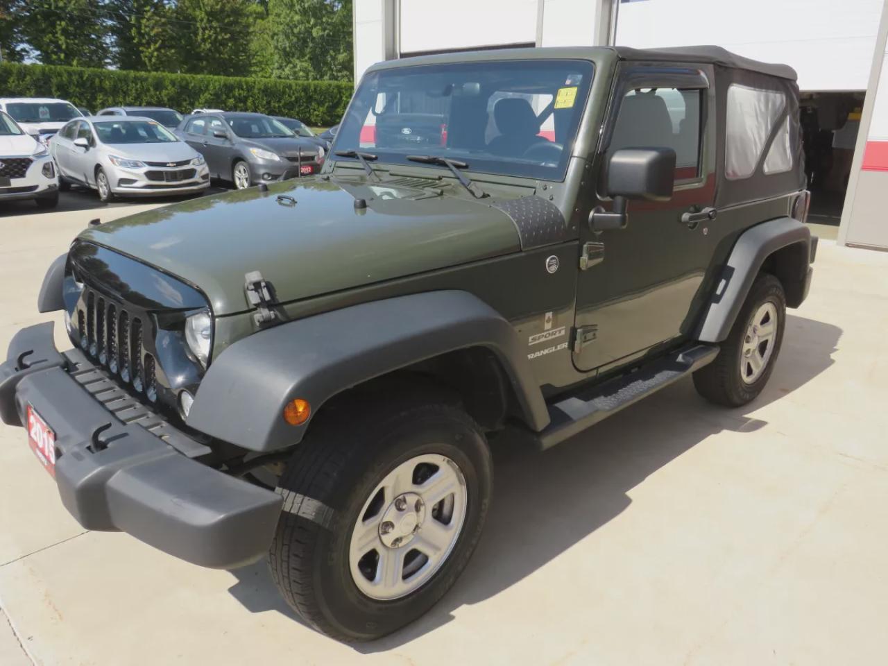 2015 Jeep Wrangler Sport (**SAFETY/CERTIFIED!!**MANUAL TRANSMISSION**4WD**ALLOY RIMS**RUNNING BOARDS**TRAILER HITCH**SOFT TOP**CUSTOM JEEP RUBBER FLOOR MATS**CRUISE CONTROL**) Photo