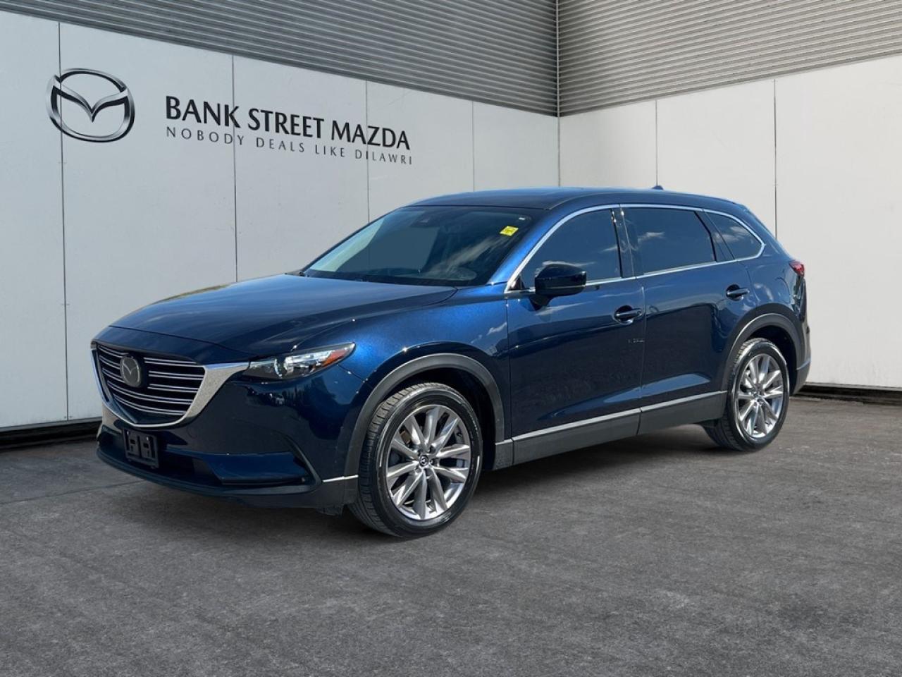 Step into the world of the 2022 Mazda CX-9 GS-L AWD, showcasing a bold, commanding presence in an elegant SUV form. With the strength of an All-Wheel Drive system and precise handling, this SUV is designed to navigate various terrains with confidence. The exterior boasts stylish alloy wheels that elevate its already impressive appearance. Stepping inside, youll find a cabin designed for comfort and convenience, featuring heated seats and power-adjustable options for the ultimate driving experience. The quality materials used in the interior provide a sense of luxury and sophistication. The Mazda CX-9 is equipped with the latest technology to enhance your journey. Enjoy seamless connectivity through smart device integration and a crisp, clear view from the backup camera when reversing. Safety is prioritized with features like lane assist and brake assist, ensuring peace of mind on every drive. This SUV is perfect for families or individuals who need a spacious yet refined vehicle with reliable performance. Experience the features first-hand and imagine yourself behind the wheel by contacting us today for more information.