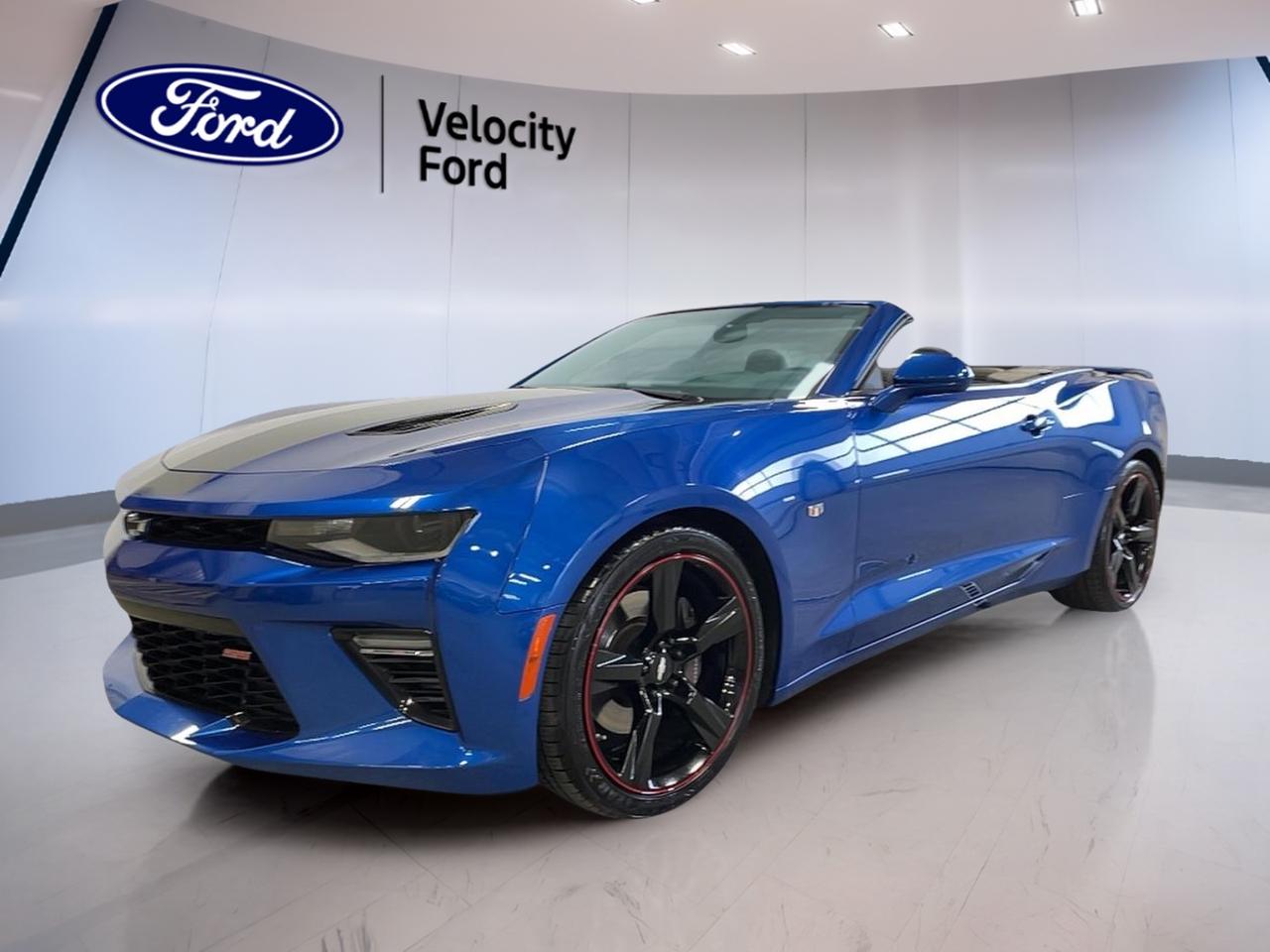 Experience the thrill of open-air driving with the 2017 Chevrolet Camaro 2dr Convertible 2SS, now available at Velocity Ford in Moose Jaw. With its striking blue exterior and sleek black interior, this Camaro stands out on every road. Powered by a robust 6.2-litre gas engine paired to a smooth automatic transmission, it delivers exhilarating performance and unmistakable style. This two-door convertible has travelled just 39,389 km, making it a fantastic choice for those seeking both excitement and reliability.

FEATURES OF THE Camaro 2dr Conv 2SS  
»» High-performance 6.2-litre V8 engine  
»» Distinctive convertible soft-top design  
»» Dual exhaust system for sporty sound  
»» Premium 20-inch alloy wheels  

ADVANCED SAFETY FEATURES  
»» Rearview camera for confident reversing  
»» Stability control for safer handling  
»» Four-wheel anti-lock disc brakes  
»» Comprehensive airbag system  

PERFORMANCE AND EFFICIENCY  
»» 455 horsepower for thrilling acceleration  
»» Automatic transmission for effortless driving  
»» Rear-wheel drive for dynamic handling  
»» Efficient fuel management system  

COMFORT AND CONVENIENCE  
»» Dual-zone automatic climate control  
»» Power-adjustable driver and passenger seats  
»» Keyless entry and push-button start  
»» Power convertible roof for easy operation  

TECHNONOLGY AND CONNECTIVITY  
»» Chevrolet MyLink infotainment system  
»» Bluetooth hands-free calling and audio streaming  
»» Premium sound system for immersive listening  
»» USB ports for device charging and connectivity  

CARGO SPACE  
»» Sizable trunk for a convertible model  
»» Split-folding rear seatbacks for added flexibility  
»» Convenient storage compartments in cabin  
»» Easy access to cargo with wide trunk opening  

WHAT OTHER OWNERS LIKE  
»» Powerful V8 engine and responsive handling  
»» Eye-catching design and convertible fun  
»» User-friendly infotainment system  
»» Comfortable ride for daily driving and road trips  

This 2017 Chevrolet Camaro 2dr Conv 2SSs VIN is: 1g1fh3d72h0203178.