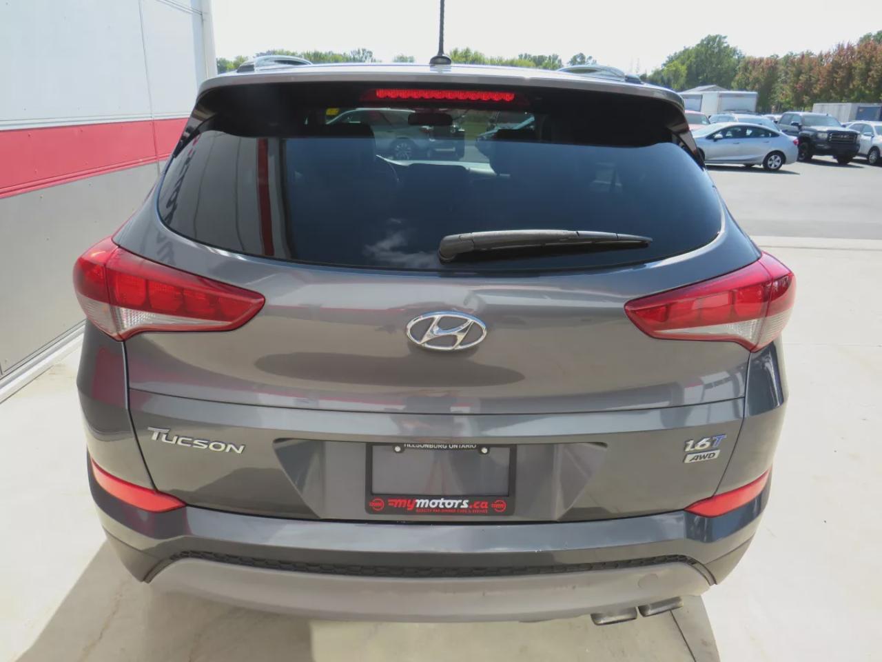 2017 Hyundai Tucson SE  (**SAFETY/CERTIFIED!!**AWD**ALLOY RIMS**LEATHER**POWER SEATS**PANORAMIC SUNROOF**HEATED STEERING WHEEL**BLIND SPOT MONITORING**FRONT AND REAR HEATED SEATS**USB**DIGITAL TOUCHSCREEN**BLUETOOTH**CRUISE CONTROL**) Photo