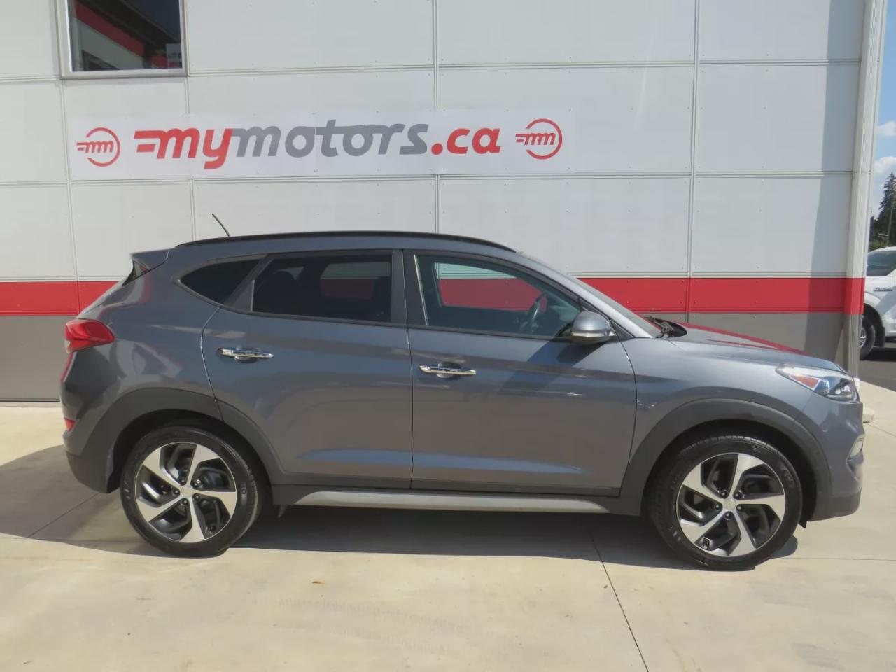 2017 Hyundai Tucson SE  (**SAFETY/CERTIFIED!!**AWD**ALLOY RIMS**LEATHER**POWER SEATS**PANORAMIC SUNROOF**HEATED STEERING WHEEL**BLIND SPOT MONITORING**FRONT AND REAR HEATED SEATS**USB**DIGITAL TOUCHSCREEN**BLUETOOTH**CRUISE CONTROL**) Photo