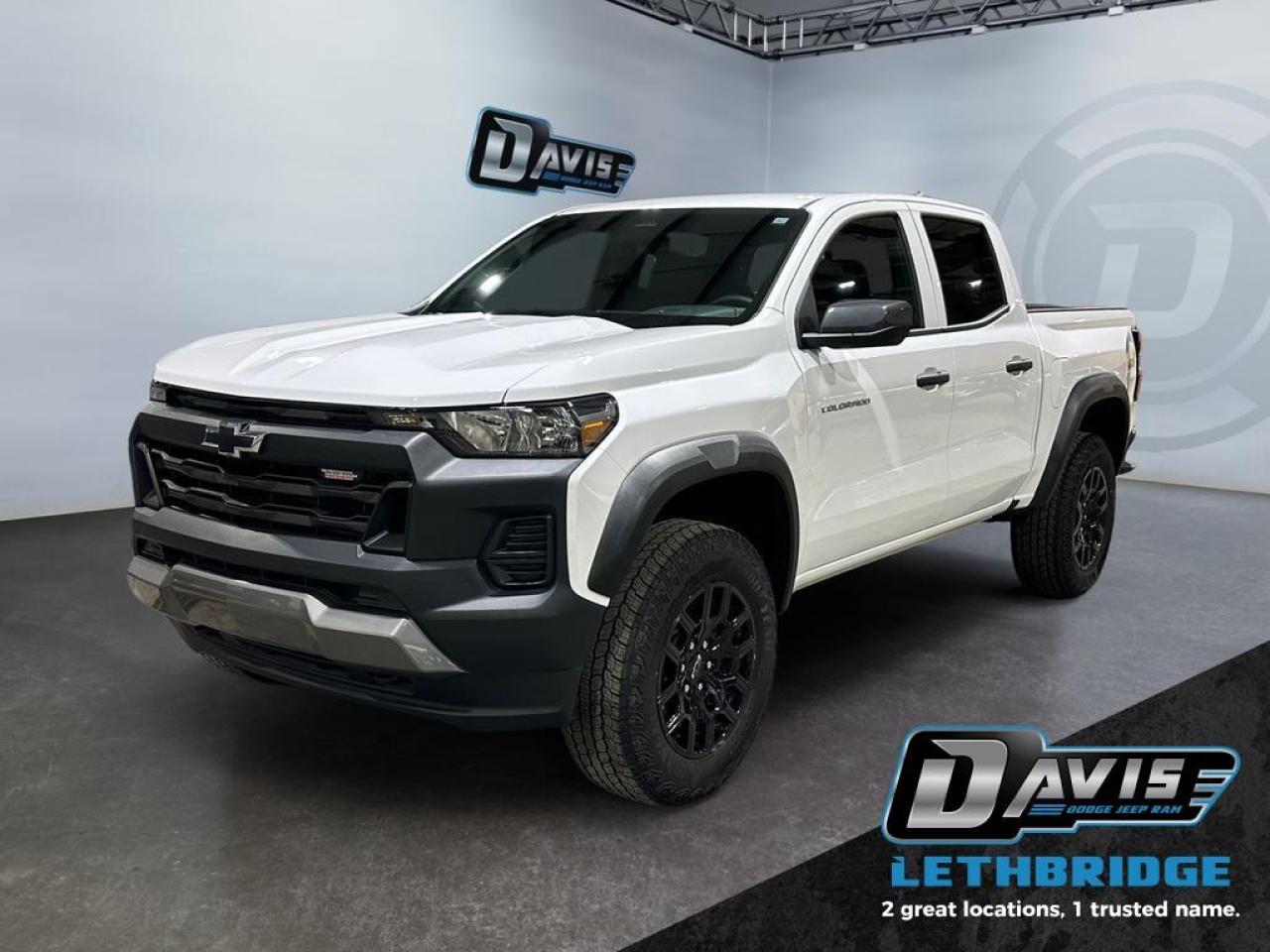 <b>2.7L - Trail Boss Pkg - Apple Car Play/Android Auto - Leather - Heated Seats - 4x4 <br /> <br /></b><br /> This 2025 Chevrolet Colorado is for sale today in Lethbridge. <br /> <br />With robust powertrain options and an incredibly refined interior, this Chevrolet Colorado is simply unstoppable. Boasting a raft of features for supreme off-roading prowess, this truck will take you over all terrain and back, without breaking a sweat. This 2025 Colorado is a great embodiment of versatility, capability and great value. This low mileage Crew Cab 4X4 pickup has just 12,446 km. Stock number 40562 is White in colour and is completely accident free based on the <a href=https://vhr.carfax.ca/?id=pnYeqLz26CwuTQUmwdaZH7xRBIQly2hM target=_blank rel=nofollow noopener noreferrer>CARFAX Report</a>. It has an Automatic transmission and is powered by a 310HP 2.7L 4 Cylinder Engine. <br /> <br /> Our Colorado's trim level is Trail Boss. Tackle the great outdoors in this Colorado Trail Boss, with upgraded all-terrain aluminum wheels, hill descent control, a locking rear differential and off-roading suspension with switchable drive modes, along with push button start and daytime running lights, along with great standard features such as a vivid 11.3-inch diagonal infotainment screen with Apple CarPlay and Android Auto, remote keyless entry, air conditioning, and a 6-speaker audio system. Safety features include automatic emergency braking, front pedestrian braking, lane keeping assist with lane departure warning, Teen Driver, and forward collision alert with IntelliBeam high beam assist. This vehicle has been upgraded with the following features: Off-Road Suspension, Aluminum Wheels, Apple CarPlay, Android Auto, Proximity Key, Lane Keep Assist, Lane Departure Warning.<br /> <br />To apply right now for financing use this link: <a href=https://www.bridgecitychrysler.com/pre-approval/ target=_blank rel=nofollow noopener noreferrer>https://www.bridgecitychrysler.com/pre-approval/</a><br /><br /> <br /><br />Locally Owned & Trusted for Over 35 Years  Bridge City Chrysler in Lethbridge, AB <br /><br /> At Bridge City Chrysler, weve proudly served the Lethbridge community for more than 35 years, offering an unparalleled car buying experience. Dont just take our word for itour Google reviews speak volumes about our commitment to exceptional service. <br /><br /> Delivery & At-Home Test Drives: Convenient options to suit your lifestyle. <br /><br /> Flexible Financing for Everyone: Get the vehicle you need with financing solutions tailored to your situation. <br /><br /> Full Mechanical Inspections & Professional Cleaning: Every vehicle is thoroughly inspected and cleaned before it hits our lot.<br /><br /> We take all makes and models on trade and offer competitive pricing with inventory that changes daily. Whether you're shopping for a Chrysler, Dodge, Jeep, RAM, or FIAT, our AMVIC Licensed dealership makes it easy to browse, buy, and drive away.<br /><br /> Located in Lethbridge, AB, we proudly serve customers in Fort Macleod, Taber, Claresholm, and Coaldale. Shop online or visit us today to experience the best in sales, service, and selection. Standard bank rates apply; taxes are additional.<br /><br /> Vehicle pricing offer shown expires 2026-01-31. <br /> Come by and check out our fleet of 80+ used cars and trucks and 130+ new cars and trucks for sale in Lethbridge. o~o