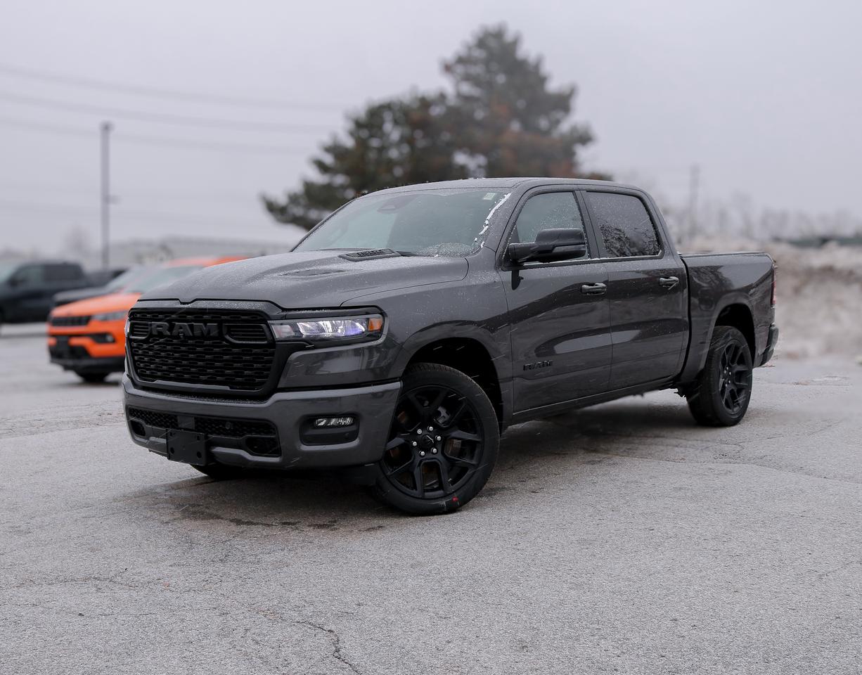 Bold and refined, our New 2026 RAM 1500 Sport Crew Cab 4X4 Night Edition in Granite Crystal Metallic delivers stylish strength that stands out anywhere. Motivated by a Twin-TurboCharged 3.0 Litre Hurricane 6 Cylinder generating 420hp for an 8 Speed Automatic transmission. This Four Wheel Drive truck loves to tow and haul with that setup, and it achieves approximately 9.7L/100km on the highway. Dynamic exterior details include LED lighting, fog lamps, body-color accents, 20-inch black alloy wheels, a damped tailgate, and heated power-folding mirrors.  Our Sport cabin is specially crafted for active owners who prefer features like heated cloth front seats, 12-way power for the driver, a leather-wrapped steering wheel, dual-zone automatic climate control, power-adjustable pedals, remote start, keyless access/ignition, a powered rear window, and top-shelf technologies. The Uconnect&reg; infotainment system bundles a 12-inch touchscreen, a 12-inch driver display, full-colour navigation, voice recognition, Apple CarPlay&reg;, Android Auto&reg;, Bluetooth&reg;, and 10-speaker audio.  RAM encourages safer trucking with automatic braking, forward collision warning, a surround-view camera system, trailer-compatible blind-spot monitoring, rear cross-traffic alert, trailer-sway damping, electronic stability/traction control, hill start assist, and more. Committed to truck leadership, our 1500 Sport is a compelling choice! Save this Page and Call for Availability. We Know You Will Enjoy Your Test Drive Towards Ownership!