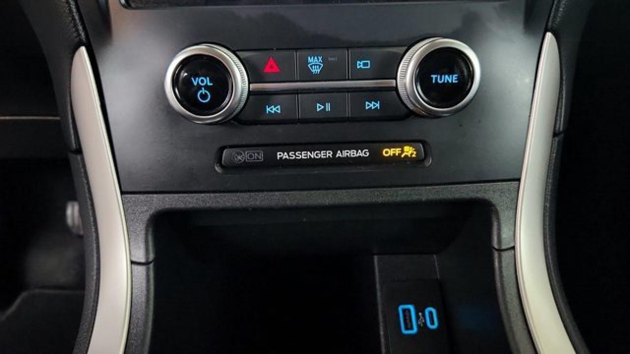 12990943