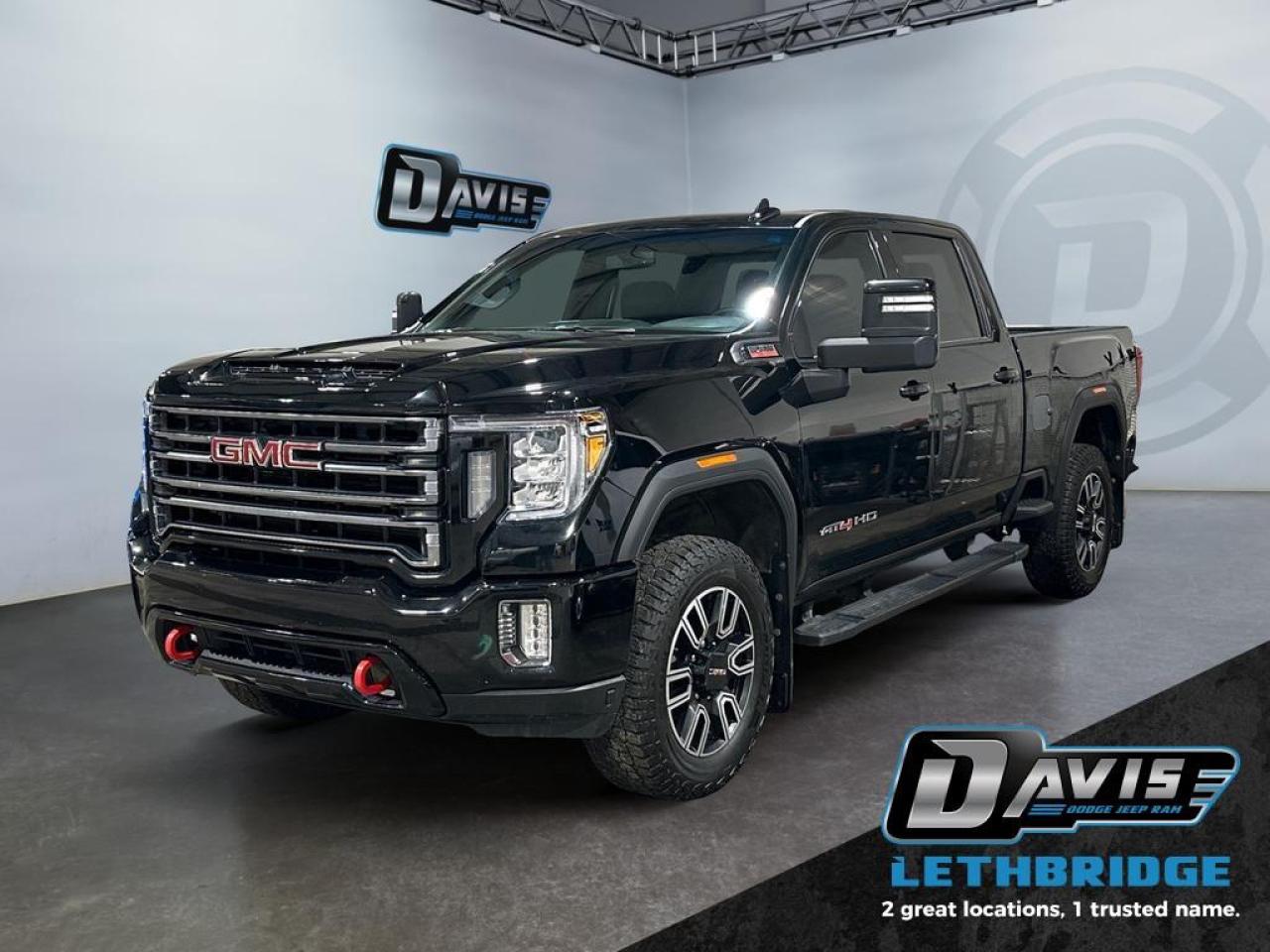 <b>6.6L Duramax Diesel - AT4 Edition - Leather - Side Steps - Navigation - Box Liner - Clean HD! <br /> <br /></b><br /> This GMC Sierra HD brings next level utility and style in a Professional Grade package. This 2023 GMC Sierra 3500HD is for sale today in Lethbridge. <br /> <br />This GMC Sierra HD is here to change trucks forever. With useful features designed to make your work day easier, along with professional grade comforts, you'll never want to go back. Experience professional grade capability and next level comfort over rough terrain with it's expertly designed seats and pro grade suspension. This GMC Sierra 3500HD is strong enough to get the job done no matter the conditions, while remaining comfortable and stylish enough to be the family adventure vehicle. This sought after diesel Crew Cab 4X4 pickup has 129,735 km. Stock number 40602 is Black in colour. It has an Automatic transmission and is powered by a 445HP 6.6L 8 Cylinder Engine. <br /> <br /> Our Sierra 3500HD's trim level is AT4. Get ready to shred with this Sierra HD AT4, complete with an off-road suspension package, skid plates, hill descent control, red recovery hooks, a spray on bedliner and a blacked-out front grille. This sweet truck also comes with leather cooled seats, power adjustable pedals with memory settings, a heavy-duty locking rear differential, signature LED lighting, a larger 8 inch touchscreen premium infotainment system with wireless Apple CarPlay, Android Auto and 4G LTE capability, stylish aluminum wheels, remote keyless entry and a remote engine start, a CornerStep rear bumper and cargo tie downs hooks with LED box lighting. Additionally, this truck also comes with a useful rear vision camera with hitch guidance, a leather wrapped steering wheel with audio controls, and a ProGrade trailering system with an integrated brake controller. This vehicle has been upgraded with the following features: Leather Seats, Cooled Seats, Off-Road Suspension, Power Pedals, Apple CarPlay, Android Auto, LED Lights.<br /> <br />To apply right now for financing use this link: <a href=https://www.bridgecitychrysler.com/pre-approval/ target=_blank rel=nofollow noopener noreferrer>https://www.bridgecitychrysler.com/pre-approval/</a><br /><br /> <br /><br />Locally Owned & Trusted for Over 35 Years  Bridge City Chrysler in Lethbridge, AB <br /><br /> At Bridge City Chrysler, weve proudly served the Lethbridge community for more than 35 years, offering an unparalleled car buying experience. Dont just take our word for itour Google reviews speak volumes about our commitment to exceptional service. <br /><br /> Delivery & At-Home Test Drives: Convenient options to suit your lifestyle. <br /><br /> Flexible Financing for Everyone: Get the vehicle you need with financing solutions tailored to your situation. <br /><br /> Full Mechanical Inspections & Professional Cleaning: Every vehicle is thoroughly inspected and cleaned before it hits our lot.<br /><br /> We take all makes and models on trade and offer competitive pricing with inventory that changes daily. Whether you're shopping for a Chrysler, Dodge, Jeep, RAM, or FIAT, our AMVIC Licensed dealership makes it easy to browse, buy, and drive away.<br /><br /> Located in Lethbridge, AB, we proudly serve customers in Fort Macleod, Taber, Claresholm, and Coaldale. Shop online or visit us today to experience the best in sales, service, and selection. Standard bank rates apply; taxes are additional.<br /><br /> Vehicle pricing offer shown expires 2026-01-31. <br /> Come by and check out our fleet of 80+ used cars and trucks and 130+ new cars and trucks for sale in Lethbridge. o~o