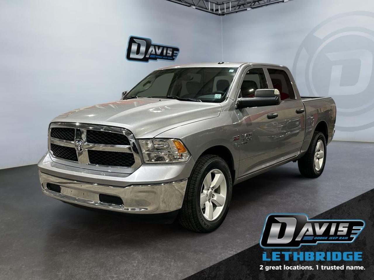 <b>5.7L Hemi - Trailer Tow Mirrors and Brake - 6 Passenger - 20" Wheels - Bluetooth - 4x4 <br /> <br /></b><br /> Reliable, dependable, and innovative, this Ram 1500 Classic proves that it has what it takes to get the job done right. This 2023 Ram 1500 Classic is for sale today in Lethbridge. <br /> <br />The reasons why this Ram 1500 Classic stands above its well-respected competition are evident: uncompromising capability, proven commitment to safety and security, and state-of-the-art technology. From its muscular exterior to the well-trimmed interior, this 2023 Ram 1500 Classic is more than just a workhorse. Get the job done in comfort and style while getting a great value with this amazing full-size truck. This Crew Cab 4X4 pickup has 53,571 km. Stock number 40596 is Silver in colour. It has an Automatic transmission and is powered by a 395HP 5.7L 8 Cylinder Engine. <br /> <br /> Our 1500 Classic's trim level is SLT. This Ram 1500 SLT steps things up with upgraded aluminum wheels, proximity keyless entry, USB connectivity and exterior chrome styling, along with a great selection of standard features such as a wiring harness, , heavy-duty suspension, cargo box lighting, and a locking tailgate. Additional features include heated and power adjustable side mirrors, UCconnect 3, cruise control, air conditioning, vinyl floor lining, and a rearview camera. This vehicle has been upgraded with the following features: Aluminum Wheels, Proximity Key, Heavy Duty Suspension, Power Mirrors, Rear Camera.<br /> <br />To apply right now for financing use this link: <a href=https://www.bridgecitychrysler.com/pre-approval/ target=_blank rel=nofollow noopener noreferrer>https://www.bridgecitychrysler.com/pre-approval/</a><br /><br /> <br /><br />Locally Owned & Trusted for Over 35 Years  Bridge City Chrysler in Lethbridge, AB <br /><br /> At Bridge City Chrysler, weve proudly served the Lethbridge community for more than 35 years, offering an unparalleled car buying experience. Dont just take our word for itour Google reviews speak volumes about our commitment to exceptional service. <br /><br /> Delivery & At-Home Test Drives: Convenient options to suit your lifestyle. <br /><br /> Flexible Financing for Everyone: Get the vehicle you need with financing solutions tailored to your situation. <br /><br /> Full Mechanical Inspections & Professional Cleaning: Every vehicle is thoroughly inspected and cleaned before it hits our lot.<br /><br /> We take all makes and models on trade and offer competitive pricing with inventory that changes daily. Whether you're shopping for a Chrysler, Dodge, Jeep, RAM, or FIAT, our AMVIC Licensed dealership makes it easy to browse, buy, and drive away.<br /><br /> Located in Lethbridge, AB, we proudly serve customers in Fort Macleod, Taber, Claresholm, and Coaldale. Shop online or visit us today to experience the best in sales, service, and selection. Standard bank rates apply; taxes are additional.<br /><br /> Vehicle pricing offer shown expires 2026-01-31. <br /> Come by and check out our fleet of 80+ used cars and trucks and 130+ new cars and trucks for sale in Lethbridge. o~o
