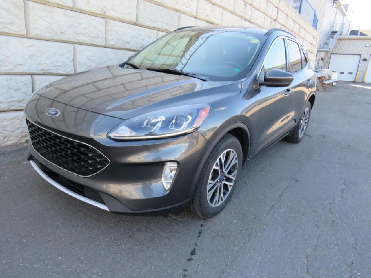 Recent Arrival!Magnetic 2020 Ford Escape SEL AWD 8-Speed Automatic 1.5L EcoBoostAWD, 3.81 Axle Ratio, 4-Wheel Disc Brakes, 6 Speakers, ABS brakes, Adaptive Cruise Control (ACC) w/Stop & Go, Air Conditioning, Alloy wheels, AM/FM radio: SiriusXM, Auto High-beam Headlights, Automatic temperature control, Block heater, Brake assist, Bumpers: body-colour, Compass, Delay-off headlights, Driver door bin, Driver vanity mirror, Dual front impact airbags, Dual front side impact airbags, Electronic Stability Control, Emergency communication system: SYNC 3 911 Assist, Equipment Group 301A, Ford Co-Pilot360 Assist, Four wheel independent suspension, Front anti-roll bar, Front Bucket Seats, Front fog lights, Front reading lights, Fully automatic headlights, Heated ActiveX Material Spt Contour Fr Bucket Seats, Heated door mirrors, Heated front seats, Heated steering wheel, Illuminated entry, Knee airbag, Leather steering wheel, Low tire pressure warning, Memory seat, Occupant sensing airbag, Outside temperature display, Overhead airbag, Overhead console, Panic alarm, Passenger door bin, Passenger vanity mirror, Power door mirrors, Power driver seat, Power Liftgate, Power steering, Power windows, Radio data system, Radio: AM/FM Stereo w/SiriusXM, Rear anti-roll bar, Rear reading lights, Rear window defroster, Rear window wiper, Remote keyless entry, Speed control, Speed-sensing steering, Speed-Sensitive Wipers, Split folding rear seat, Spoiler, Steering wheel mounted audio controls, SYNC 3 Communications & Entertainment System, SYNC 3/Apple CarPlay/Android Auto, Tachometer, Telescoping steering wheel, Tilt steering wheel, Traction control, Trip computer, Variably intermittent wipers, Voice-Activated Touchscreen Navigation System, Wheels: 18 Machined-Face Alum w/Dk Stainless Pnt.Certification Program Details: 80 Point Inspection Fresh Oil Change Full Vehicle Detail Full tank of Gas 2 Years Fresh MVI Brake through InspectionAt Steele GMC Buick Fredericton, were proud to be your Used Car Mega Center serving drivers all across Atlantic Canada from Fredericton, Oromocto, New Maryland, Woodstock, Saint John, and Moncton in New Brunswick, to Nova Scotia, Prince Edward Island, and Newfoundland. Our inventory features all makes and models of used cars, trucks, SUVs, and vans, giving you the best selection in the region. Whether you need a fuel-efficient sedan, a family SUV, or a rugged pickup, youll find it right here at Steele GMC Buick Fredericton. With our Market Value Pricing, every vehicle is priced based on real-time market conditions, ensuring you get the best possible deal without the hassle of negotiating. We keep pricing transparent and competitive so you can shop with total confidence. No matter your credit situation good, bad, or no credit at all youre approved. Our finance experts work with lenders across Atlantic Canada to find the best terms for your budget, including second-chance financing, newcomer programs, and credit rebuilding solutions. As part of Steele Auto Group, Atlantic Canadas most diversified automotive group with 47 dealerships representing 27 brands, we offer unmatched selection, buying power, and customer support. That means if the vehicle you want isnt on our Fredericton lot, we can source it quickly from our massive dealer network across the Maritimes. When it comes to used vehicles, Steele GMC Buick Fredericton is the destination for drivers all across Atlantic Canada delivering market value pricing, every make and model, and guaranteed credit approval so you can get on the road with confidence.Steele Auto Group is the most diversified group of automobile dealerships in Atlantic Canada, with 47 dealerships selling 27 brands and an employee base of well over 2300.Awards:* JD Power Canada Automotive Performance, Execution and Layout (APEAL) Study