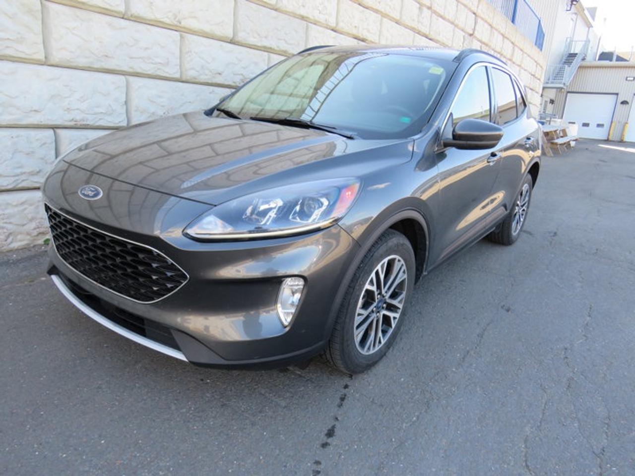 New Price!Magnetic 2020 Ford Escape SEL AWD 8-Speed Automatic 1.5L EcoBoostAWD, 3.81 Axle Ratio, 4-Wheel Disc Brakes, 6 Speakers, ABS brakes, Adaptive Cruise Control (ACC) w/Stop & Go, Air Conditioning, Alloy wheels, AM/FM radio: SiriusXM, Auto High-beam Headlights, Automatic temperature control, Block heater, Brake assist, Bumpers: body-colour, Compass, Delay-off headlights, Driver door bin, Driver vanity mirror, Dual front impact airbags, Dual front side impact airbags, Electronic Stability Control, Emergency communication system: SYNC 3 911 Assist, Equipment Group 301A, Ford Co-Pilot360 Assist, Four wheel independent suspension, Front anti-roll bar, Front Bucket Seats, Front fog lights, Front reading lights, Fully automatic headlights, Heated ActiveX Material Spt Contour Fr Bucket Seats, Heated door mirrors, Heated front seats, Heated steering wheel, Illuminated entry, Knee airbag, Leather steering wheel, Low tire pressure warning, Memory seat, Occupant sensing airbag, Outside temperature display, Overhead airbag, Overhead console, Panic alarm, Passenger door bin, Passenger vanity mirror, Power door mirrors, Power driver seat, Power Liftgate, Power steering, Power windows, Radio data system, Radio: AM/FM Stereo w/SiriusXM, Rear anti-roll bar, Rear reading lights, Rear window defroster, Rear window wiper, Remote keyless entry, Speed control, Speed-sensing steering, Speed-Sensitive Wipers, Split folding rear seat, Spoiler, Steering wheel mounted audio controls, SYNC 3 Communications & Entertainment System, SYNC 3/Apple CarPlay/Android Auto, Tachometer, Telescoping steering wheel, Tilt steering wheel, Traction control, Trip computer, Variably intermittent wipers, Voice-Activated Touchscreen Navigation System, Wheels: 18 Machined-Face Alum w/Dk Stainless Pnt.Certification Program Details: 80 Point Inspection Fresh Oil Change Full Vehicle Detail Full tank of Gas 2 Years Fresh MVI Brake through InspectionAt Steele GMC Buick Fredericton, were proud to be your Used Car Mega Center serving drivers all across Atlantic Canada from Fredericton, Oromocto, New Maryland, Woodstock, Saint John, and Moncton in New Brunswick, to Nova Scotia, Prince Edward Island, and Newfoundland. Our inventory features all makes and models of used cars, trucks, SUVs, and vans, giving you the best selection in the region. Whether you need a fuel-efficient sedan, a family SUV, or a rugged pickup, youll find it right here at Steele GMC Buick Fredericton. With our Market Value Pricing, every vehicle is priced based on real-time market conditions, ensuring you get the best possible deal without the hassle of negotiating. We keep pricing transparent and competitive so you can shop with total confidence. No matter your credit situation good, bad, or no credit at all youre approved. Our finance experts work with lenders across Atlantic Canada to find the best terms for your budget, including second-chance financing, newcomer programs, and credit rebuilding solutions. As part of Steele Auto Group, Atlantic Canadas most diversified automotive group with 47 dealerships representing 27 brands, we offer unmatched selection, buying power, and customer support. That means if the vehicle you want isnt on our Fredericton lot, we can source it quickly from our massive dealer network across the Maritimes. When it comes to used vehicles, Steele GMC Buick Fredericton is the destination for drivers all across Atlantic Canada delivering market value pricing, every make and model, and guaranteed credit approval so you can get on the road with confidence.Steele Auto Group is the most diversified group of automobile dealerships in Atlantic Canada, with 47 dealerships selling 27 brands and an employee base of well over 2300.Awards:* JD Power Automotive Performance, Execution and Layout (APEAL) Study