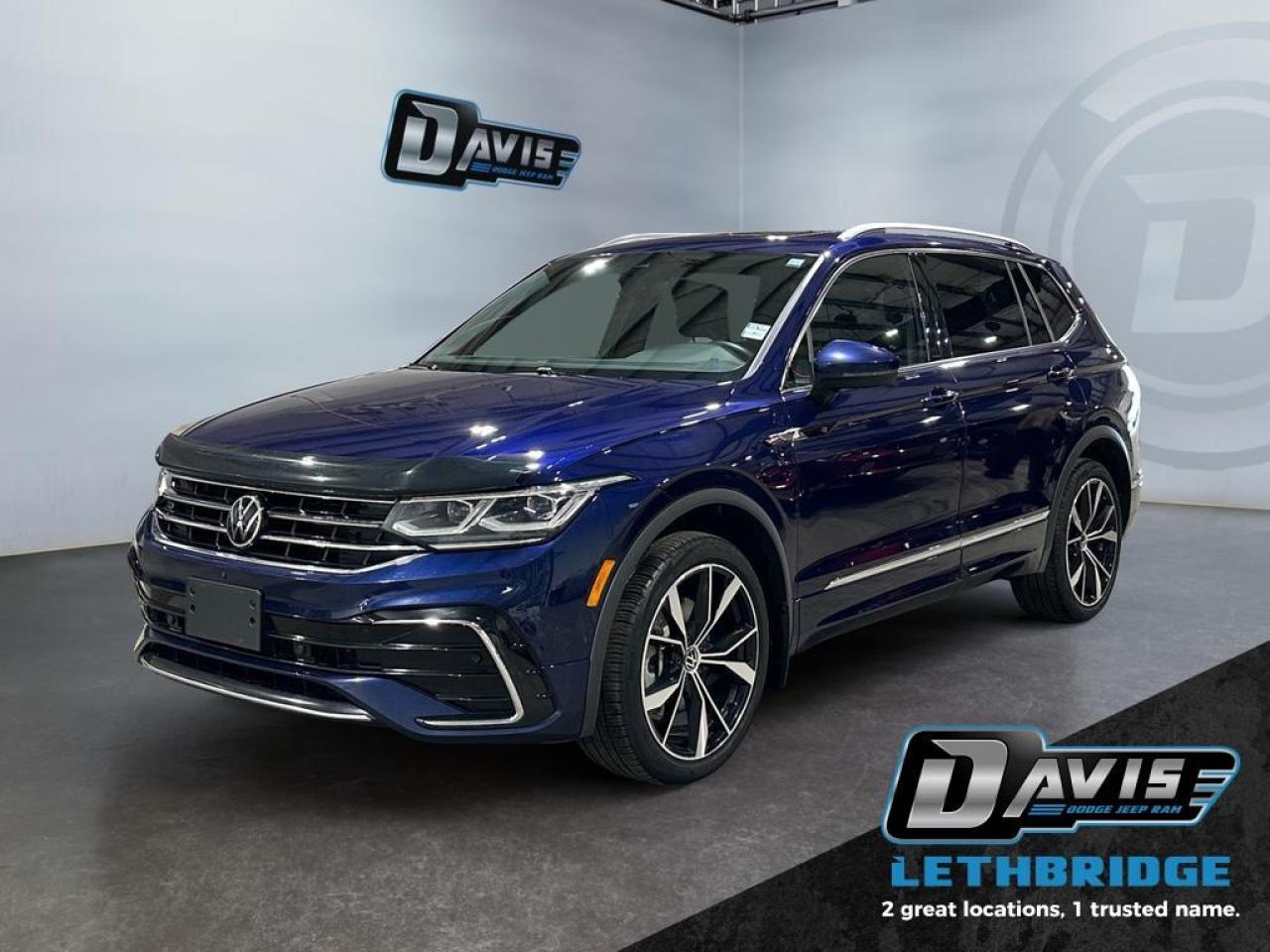 <b>Highline R-Line - Leather - Sunroof - Heated Seats - Navigation - Adaptive Cruise Control - LED Lights - AWD <br /> <br /></b><br /> Everything from capacity, capability, comfort, and ease of use was designed with relentless purpose on this 2022 Tiguan. This 2022 Volkswagen Tiguan is for sale today in Lethbridge. <br /> <br />Whether it's a weekend warrior or the daily driver this time, this 2022 Tiguan makes every experience easier to manage. Cutting edge tech, both inside the cabin and under the hood, allow for safe, comfy, and connected rides that keep the whole party going. The crossover of the future is already here, and it's called the Tiguan. This SUV has 83,455 km. Stock number 40618 is Blue in colour and is completely accident free based on the <a href=https://vhr.carfax.ca/?id=9UyBxTWJS0mDu56Iy2/7HD9g6J10NUtn target=_blank rel=nofollow noopener noreferrer>CARFAX Report</a>. It has an Automatic transmission and is powered by a 184HP 2.0L 4 Cylinder Engine. <br /> <br /> Our Tiguan's trim level is Highline R-Line. Upgrading to this top of the line Tiguan Highline R-Line is a great choice as it comes fully loaded with a 360 degree view camera, large 8 inch infotainment touchscreen that's paired with Volkswagen Car-Net, a Fender premium audio system, wireless Android Auto and Apple CarPlay, heated and cooled leather seats with exclusive heated rear seats, a heated steering wheel, power liftgate and blind spot detection. This premium family SUVW also includes exclusive aluminum wheels and chrome exterior accents, power front seats, automatic LED lights, remote engine start, a 40/20/40 split-folding rear seats, an advanced 10 inch digital cockpit, power heated mirrors, front and rear parking assist with autonomous emergency braking, KESSY keyless access with push-start button plus so much more! This vehicle has been upgraded with the following features: Sunroof, Leather Seats, Cooled Seats, Premium Audio, 360 Camera, Power Liftgate, Remote Start.<br /> <br />To apply right now for financing use this link: <a href=https://www.bridgecitychrysler.com/pre-approval/ target=_blank rel=nofollow noopener noreferrer>https://www.bridgecitychrysler.com/pre-approval/</a><br /><br /> <br /><br />Locally Owned & Trusted for Over 35 Years  Bridge City Chrysler in Lethbridge, AB <br /><br /> At Bridge City Chrysler, weve proudly served the Lethbridge community for more than 35 years, offering an unparalleled car buying experience. Dont just take our word for itour Google reviews speak volumes about our commitment to exceptional service. <br /><br /> Delivery & At-Home Test Drives: Convenient options to suit your lifestyle. <br /><br /> Flexible Financing for Everyone: Get the vehicle you need with financing solutions tailored to your situation. <br /><br /> Full Mechanical Inspections & Professional Cleaning: Every vehicle is thoroughly inspected and cleaned before it hits our lot.<br /><br /> We take all makes and models on trade and offer competitive pricing with inventory that changes daily. Whether you're shopping for a Chrysler, Dodge, Jeep, RAM, or FIAT, our AMVIC Licensed dealership makes it easy to browse, buy, and drive away.<br /><br /> Located in Lethbridge, AB, we proudly serve customers in Fort Macleod, Taber, Claresholm, and Coaldale. Shop online or visit us today to experience the best in sales, service, and selection. Standard bank rates apply; taxes are additional.<br /><br /> Vehicle pricing offer shown expires 2026-01-31. <br /> Come by and check out our fleet of 80+ used cars and trucks and 130+ new cars and trucks for sale in Lethbridge. o~o