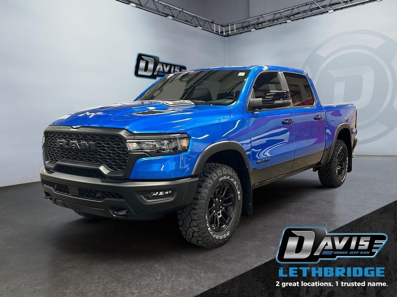<b>Off-Road Suspension, Navigation, Apple CarPlay and Android Auto, Blind Spot Monitoring!<br /> <br /></b><br /> <br /> <br />The 2026 Ram 1500 Rebel in Hydro Blue Pearl Coat delivers bold off-road capability with premium comfort. Equipped with the 3.0L I6 Hurricane Twin-Turbo engine, 8-speed automatic transmission, and 4x4 drivetrain with 3.92 rear axle and electronic rear locker, its built for rugged terrain and heavy-duty performance. The raised ride height, Rebel-tuned front and rear shocks, off-road wheel flares, skid plates, tow hooks, and Class IV receiver hitch make it adventure-ready straight from the lot.<br /><br />Inside, enjoy luxury leather-trimmed and ventilated front seats, heated second-row seats, full-length upgraded floor console, dual-zone climate control, power 8-way driver and passenger seats with memory, and active noise control. Technology features include a Uconnect 5 NAV 14.4 touchscreen, Apple CarPlay, Android Auto, GPS navigation, 19-speaker Harman Kardon premium audio, dual wireless charging, and rear-seat entertainment options.<br /><br />Safety is advanced with Adaptive Cruise Control with Stop & Go, Blind Spot and Cross Path Detection, Active Lane Management, ParkSense Front/Rear Park Assist, Pedestrian Emergency Braking, and Full-Speed Forward Collision Warning. Exterior styling highlights black Rebel grille, sport performance hood, dual black exhaust tips, Hydro Blue accents, all-terrain tires on 18 black wheels, LED lighting, and deployable Mopar bed step with spray-in bedliner.<br /> <br />To apply right now for financing use this link: <a href=https://lethbridge.davisdodge.ca/free-credit-check/ target=_blank rel=nofollow noopener noreferrer>https://lethbridge.davisdodge.ca/free-credit-check/</a><br /><br /> <br /><br />As a premier Chrysler, Dodge, Jeep and RAM dealership, Davis Dodge proudly offers an extensive selection of new and used vehicles to meet every drivers needs. Customers across Lethbridge, Fort Macleod, Taber, Claresholm, Coaldale, and beyond trust us for daily vehicle specials, certified service and parts, and a seamless online inventory experience. <br /><br /> With competitive financing options and expert support, we make car buying easy and enjoyable. <br /><br /> Ready to hit the road? Schedule your test drive today at Davis Dodge, your trusted Chrysler, Dodge, Jeep and RAM dealer in Lethbridge, Alberta.<br /><br /> Vehicle pricing offer shown expires 2026-04-30. <br /> Come by and check out our fleet of 70+ used cars and trucks and 110+ new cars and trucks for sale in Lethbridge. o~o