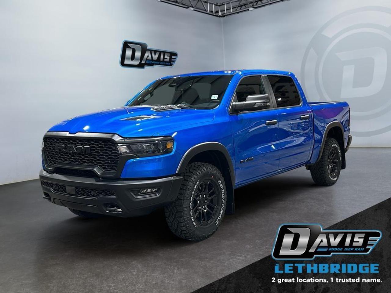 <b>Off-Road Suspension, Navigation, Apple CarPlay, Android Auto, Blind Spot Monitoring!<br /> <br /></b><br /> <br /> <br />The 2026 Ram 1500 Rebel in Hydro Blue Pearl blends rugged off-road capability with premium comfort. Powered by a 3.0L I6 Hurricane Twin-Turbo engine paired with an 8-speed automatic transmission, this 4x4 crew cab features raised ride height, E-locker rear axle, off-road wheel flares, sport performance hood, dual black exhaust tips, and black grille and bumpers for a bold, aggressive presence.<br /><br />Inside, enjoy heated cloth/vinyl bucket seats, full-length upgraded floor console, 12 Uconnect 5 NAV touchscreen, Apple CarPlay, Android Auto, and GPS navigation. The cabin also offers power 8-way driver seat, rear 60/40 folding seats, premium storage compartments, and dual-zone climate control for maximum convenience.<br /><br />Safety comes standard with Adaptive Cruise Control with Stop & Go, Blind Spot and Cross Path Detection, ParkView Rear Camera, Pedestrian Emergency Braking, and Active Lane Management System. Additional highlights include remote start, 18 mid-gloss black wheels, Mopar rubber floor mats, capless fuel fill, and Class IV receiver hitchready for any adventure.<br /> <br />To apply right now for financing use this link: <a href=https://lethbridge.davisdodge.ca/free-credit-check/ target=_blank rel=nofollow noopener noreferrer>https://lethbridge.davisdodge.ca/free-credit-check/</a><br /><br /> <br /><br />As a premier Chrysler, Dodge, Jeep and RAM dealership, Davis Dodge proudly offers an extensive selection of new and used vehicles to meet every drivers needs. Customers across Lethbridge, Fort Macleod, Taber, Claresholm, Coaldale, and beyond trust us for daily vehicle specials, certified service and parts, and a seamless online inventory experience. <br /><br /> With competitive financing options and expert support, we make car buying easy and enjoyable. <br /><br /> Ready to hit the road? Schedule your test drive today at Davis Dodge, your trusted Chrysler, Dodge, Jeep and RAM dealer in Lethbridge, Alberta.<br /><br /> Vehicle pricing offer shown expires 2026-04-30. <br /> Come by and check out our fleet of 70+ used cars and trucks and 110+ new cars and trucks for sale in Lethbridge. o~o