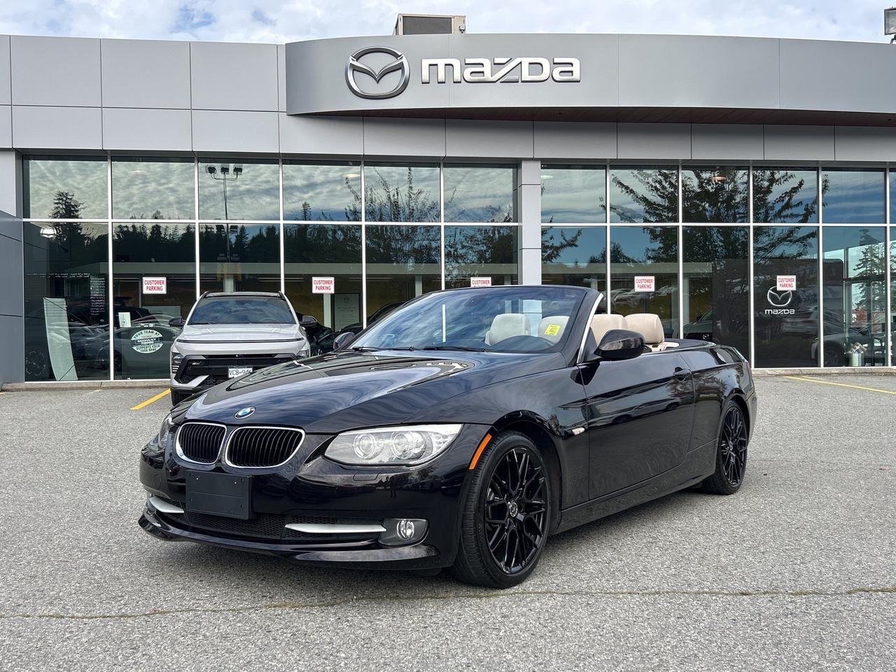 Rare 335i with Low Low KMS, Retractable Power Hardtop, 300HP Inline 6 Cylinder Engine, Automatic Transmission, Air Conditioning, Leather Interior with Wood Trim, Navigation, iDrive Infotainment Controls, Reverse Camera, Bluetooth,  Heated Seats, Alloy Wheels,  British Columbia Vehicle, Dealer Inspected, Dealer Serviced, Excellent Condition, Free CarFax Report, Full Service History, Low KM, Multi-Point Inspection, No Lien, Oil Changed, Vehicle Detailed, SO DONT WAIT TO COME ON INTO MIDWAY MAZDA TO BOOK A TEST DRIVE TODAY. Our team is professional; MVSABC Certified and we offer a no pressure environment. Finding the right vehicle at the right price, we are here to help!

- Mechanically inspected by our Licensed Mazda Master Technicians  
- This vehicle is Carfax Verified, We have nothing to hide  
- Vehicle includes Warranty at this price  
- Price subject to $599 documentation fee 
- Got a vehicle to trade? Drive it in and have our Professional Appraisers look at it!  
- Financing Available. Not sure about your credit approval? No problem, APPLY ONLINE TODAY!  
- Professional, MVSABC Certified and Friendly staff are ready to serve you!  
- Extended Warranty is available on our entire pre-owned inventory, just ask us for details!  

We have a huge variety of Pre-Owned Nissan, Honda, Toyota, Chrysler, Dodge, Subaru, Mazda, Kia, Hyundai, Ford, Lincoln, Infiniti, Fiat, Suzuki, Chevrolet, Pontiac, Jeep, GMC, Saturn, Lexus, Volkswagen, Mitsubishi Cars, Minivans, Trucks and SUV to choose from!  MIDWAY MAZDA is a family owned business that has been serving White Rock, Surrey, Burnaby, Richmond, Vancouver and Langley since 1986. At Midway Mazda we dont just sell new Mazda models such as the MAZDA3, CX-3, CX30, CX-5, MAZDA5, MAZDA6 and CX-9...We dont just offer a fantastic selection of used cars... And we certainly dont just offer high-caliber Mazda service. Rather, at Midway Mazda, we take the time to get to know each and every driver we meet. It doesnt matter if youre from Burnaby, Richmond, Vancouver or Langley; we get to know your driving style, needs, desires and maintenance habits. For people looking to buy a car, this means an amiable, pressure-free environment. Rather than push cars, Midway Mazda suggests the ones that will best meet your lifestyle and budget...For people who might not have the best memory and/or diligence when it comes to getting their new Mazda or used car serviced, we help make sure you stay on track so you can get every last mile paid for. Midway Mazda even has drivers backs covered in the event of an accident, thanks to our state-of-the-art Mazda service center and expert staff who are continuously training on the latest repairs and tools of the trade. To learn more about how Midway Mazda is dedicated to making your life easier, please contact us. Or better yet, stop in and meet us in person at 3050 King George Blvd., Surrey, British Columbia, Canada. We hope to have the pleasure of meeting you soon. Please call for availability. Dealer #8333