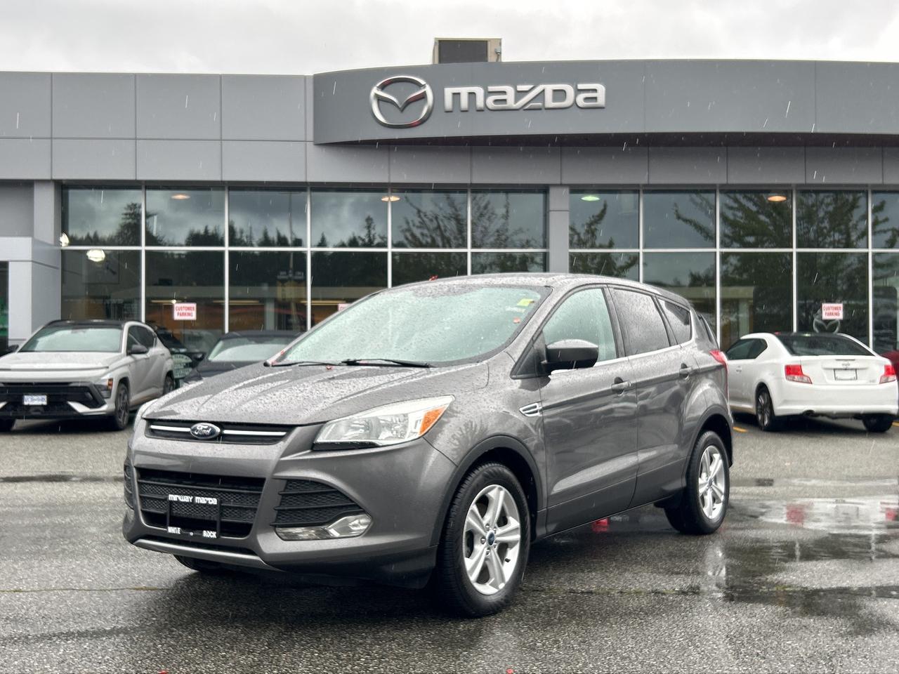 Clean Escape with SE Options, Highlights include Automatic Transmission, Air Conditioning, Alloy Wheels, Power group, Bluetooth, Reverse Camera, & more, Accident Free, British Columbia Vehicle, Dealer Inspected, Dealer Serviced, Excellent Condition, Free CarFax Report, Full Service History, Multi-Point Inspection, No Lien, Oil Changed, Vehicle Detailed, SO DONT WAIT TO COME ON INTO MIDWAY MAZDA TO BOOK A TEST DRIVE TODAY. Our team is professional; MVSABC Certified and we offer a no pressure environment. Finding the right vehicle at the right price, we are here to help!

- Mechanically inspected by our Licensed Mazda Master Technicians  
- This vehicle is Carfax Verified, We have nothing to hide  
- Vehicle includes Warranty at this price  
- Price subject to $599 documentation fee 
- Got a vehicle to trade? Drive it in and have our Professional Appraisers look at it!  
- Financing Available. Not sure about your credit approval? No problem, APPLY ONLINE TODAY!  
- Professional, MVSABC Certified and Friendly staff are ready to serve you!  
- Extended Warranty is available on our entire pre-owned inventory, just ask us for details!  

We have a huge variety of Pre-Owned Nissan, Honda, Toyota, Chrysler, Dodge, Subaru, Mazda, Kia, Hyundai, Ford, Lincoln, Infiniti, Fiat, Suzuki, Chevrolet, Pontiac, Jeep, GMC, Saturn, Lexus, Volkswagen, Mitsubishi Cars, Minivans, Trucks and SUV to choose from!  MIDWAY MAZDA is a family owned business that has been serving White Rock, Surrey, Burnaby, Richmond, Vancouver and Langley since 1986. At Midway Mazda we dont just sell new Mazda models such as the MAZDA3, CX-3, CX30, CX-5, MAZDA5, MAZDA6 and CX-9...We dont just offer a fantastic selection of used cars... And we certainly dont just offer high-caliber Mazda service. Rather, at Midway Mazda, we take the time to get to know each and every driver we meet. It doesnt matter if youre from Burnaby, Richmond, Vancouver or Langley; we get to know your driving style, needs, desires and maintenance habits. For people looking to buy a car, this means an amiable, pressure-free environment. Rather than push cars, Midway Mazda suggests the ones that will best meet your lifestyle and budget...For people who might not have the best memory and/or diligence when it comes to getting their new Mazda or used car serviced, we help make sure you stay on track so you can get every last mile paid for. Midway Mazda even has drivers backs covered in the event of an accident, thanks to our state-of-the-art Mazda service center and expert staff who are continuously training on the latest repairs and tools of the trade. To learn more about how Midway Mazda is dedicated to making your life easier, please contact us. Or better yet, stop in and meet us in person at 3050 King George Blvd., Surrey, British Columbia, Canada. We hope to have the pleasure of meeting you soon. Please call for availability. Dealer #8333