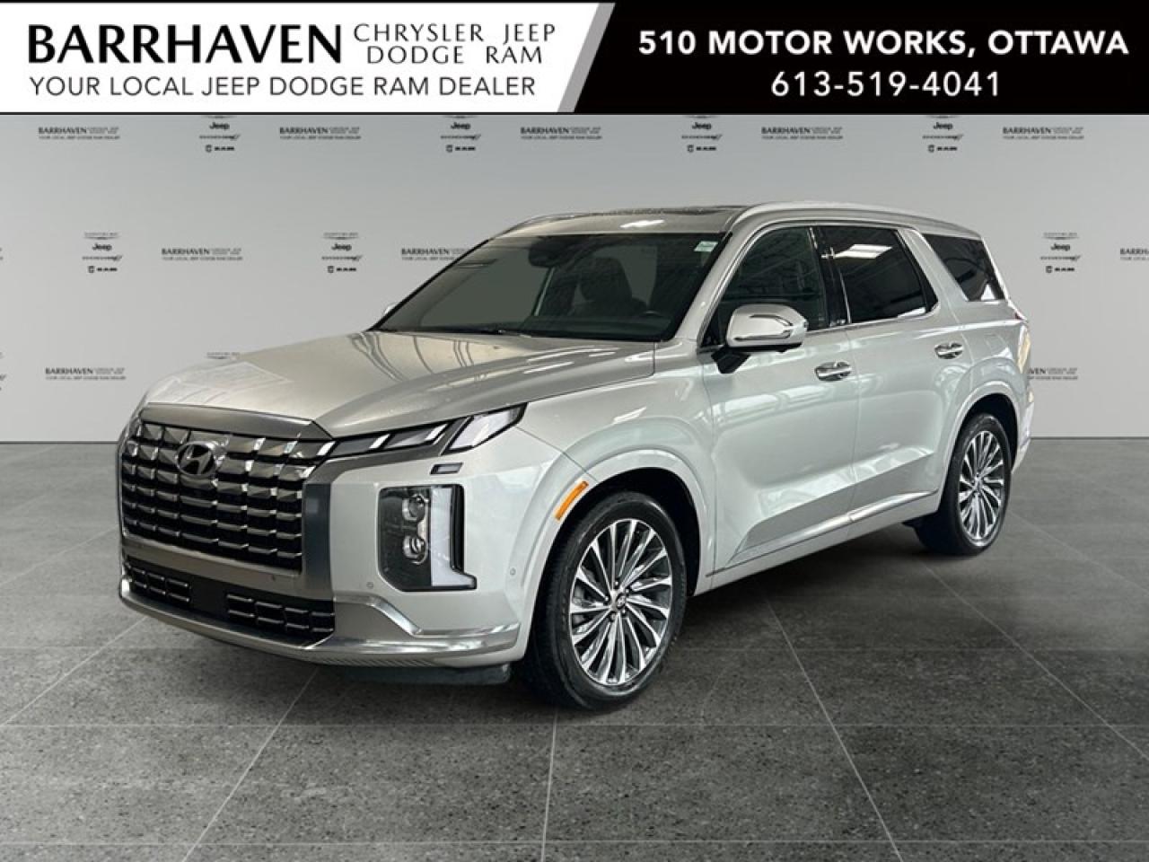 Experience the magnificent blend of luxury and performance with the 2023 Hyundai Palisade Ultimate Calligraphy 7-Passenger AWD in a striking silver finish. This all-wheel-drive (AWD) SUV ensures confident handling and outstanding stability on every journey. The Palisade boasts a sophisticated exterior, highlighted by its stylish alloy wheels. Inside, the lavish cabin features leather seats, a leather steering wheel, and metal-look instrument panel inserts, creating an atmosphere of modern elegance. With ample space for all passengers, every drive is a delight. Beyond its aesthetics, the Palisade is engineered with state-of-the-art technology. Stay connected with the navigation system, smart device integration, and satellite radio. Safety is paramount with features like automatic parking, lane assist, brake assist, and a comprehensive suite of cameras and sensors for peace of mind. The convenience of a heads-up display and adaptive cruise control enhances the driving experience. This SUV appeals to discerning families and adventure seekers looking for a spacious and refined vehicle that meets all their journey demands. Contact us now to make the Palisade yours and elevate your driving experience to new heights.