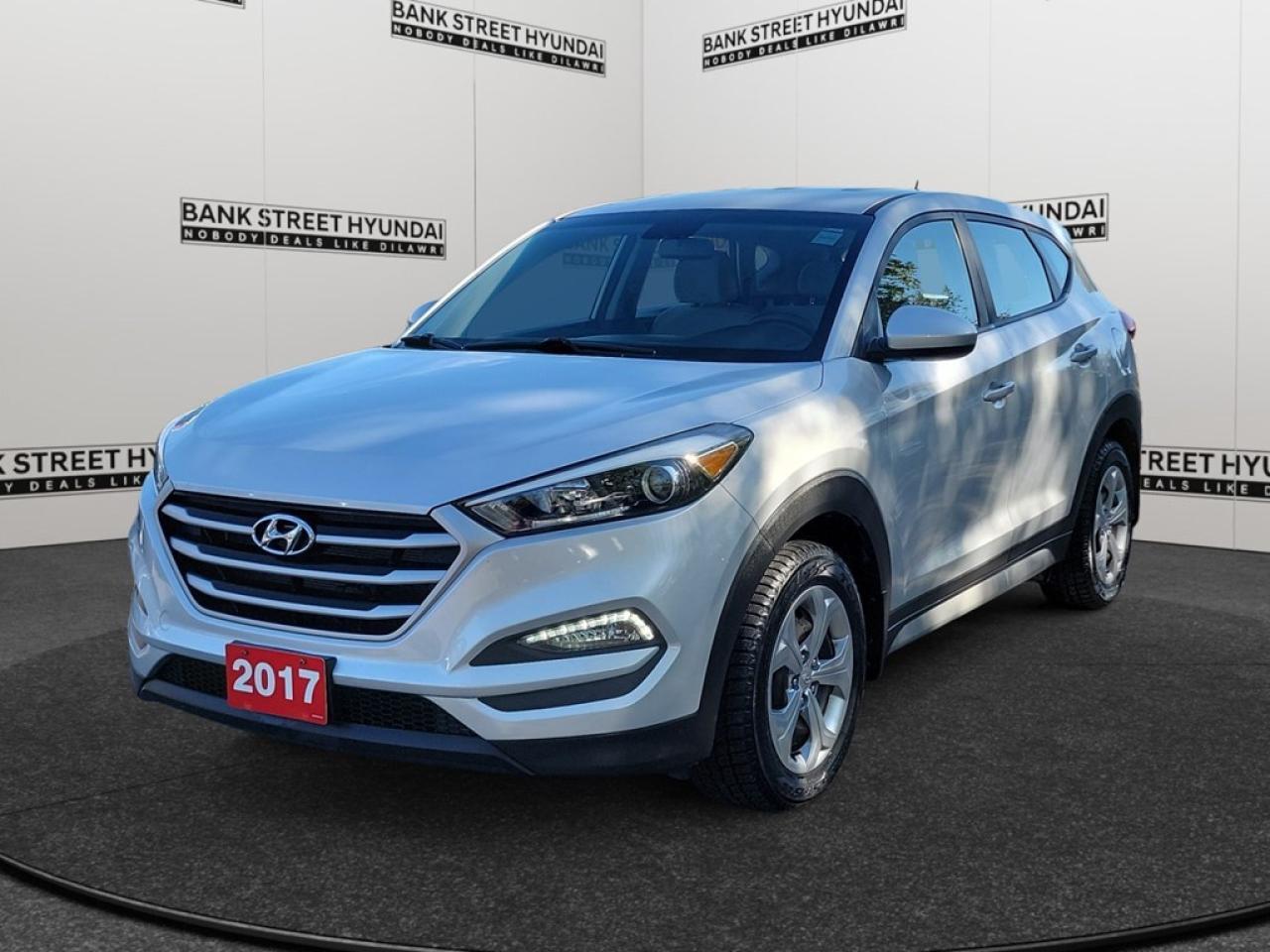 Experience the 2017 Hyundai Tucson AWD 4dr 2.0L, a stylish SUV in an elegant silver finish equipped with a powerful 2.0L 4-cylinder engine. Known for its superb handling on Canadian roads, this all-wheel-drive vehicle is perfect for those seeking both capability and aesthetics. The Tucsons distinctive exterior style is matched by a well-designed interior that offers a comfortable drive. Enjoy features like heated mirrors and front seats that keep you cozy during frosty mornings, while its keyless entry and power windows make your life easy. The spacious seating comfortably accommodates your family and friends for those weekend getaways. Stay connected and safe with the latest automotive technology. This Tucson is equipped with a backup camera and brake assist for your peace of mind during your drives. The infotainment system features a Bluetooth connection and satellite radio, ensuring you have access to entertainment and connectivity on the go, while the cruise control maintains your speed effortlessly on the highway. This SUV is perfect for families, adventurers, or anyone needing a reliable and stylish vehicle for their daily commute or family trips. Contact us today to learn more about this 2017 Hyundai Tucson and why its the vehicle of choice for those who appreciate both practicality and performance.