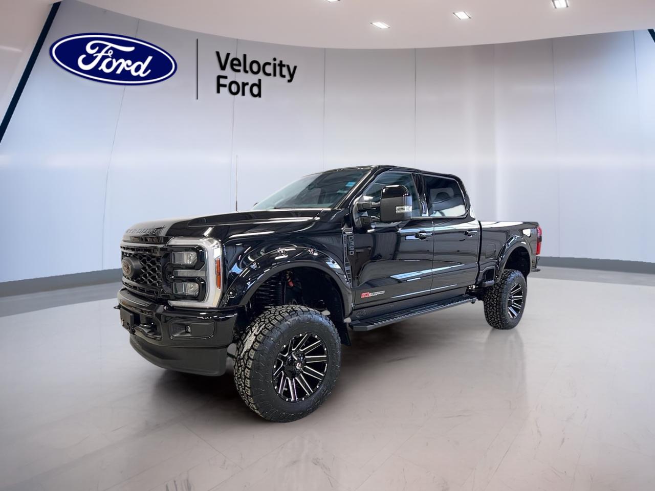 Experience uncompromising strength and innovation with the brand new 2026 Ford Super Duty F-350 SRW Lariat, now available at Velocity Ford in Moose Jaw. This commanding truck features a striking black exterior and matching black interior, blending modern style with legendary Ford durability. Equipped with a 6.7L High Output Power Stroke V8 diesel engine and advanced 4-wheel drive, its engineered for those who demand top performance and reliability. The TorqShift 10-speed automatic transmission ensures smooth shifting and optimal power delivery, making this F-350 SRW Lariat the ideal solution for heavy-duty tasks and everyday confidence.

TRUCK FEATURES  
»» 6.7L High Output Power Stroke V8 diesel engine  
»» TorqShift 10-speed automatic transmission  
»» Advanced 4-wheel drive capability  
»» Built for substantial towing and payload needs  

ADVANCED SAFETY FEATURES  
»» Comprehensive airbag system for all-around protection  
»» Advanced traction and stability control systems  
»» Anti-lock braking system for controlled stops  
»» Rearview camera for safer reversing  

PERFORMANCE AND EFFICIENCY  
»» High output diesel engine delivers exceptional torque  
»» 4-wheel drive for optimal off-road capability  
»» Smooth shifting TorqShift 10-speed automatic transmission  
»» Engineered for heavy-duty towing and hauling  

COMFORT AND CONVENIENCE  
»» Spacious black interior with ergonomic layout  
»» Dual-zone automatic climate control  
»» Power-adjustable drivers seat for personalized comfort  
»» Ample cabin storage for daily essentials  

TECHNOLOGY AND CONNECTIVITY  
»» Large touchscreen infotainment system  
»» Bluetooth connectivity for hands-free communication  
»» Multiple USB ports for device charging  
»» Premium sound system for immersive audio  

CARGO SPACE  
»» Large bed ideal for work or recreation  
»» Multiple tie-down points for secure loads  
»» Easy-access tailgate for loading and unloading  
»» Spacious cabin for tools and gear  

WHAT OTHER OWNERS LIKE  
»» Exceptional towing and payload capacity  
»» Smooth and powerful diesel performance  
»» Comfortable, quiet ride on long journeys  
»» User-friendly technology and controls  

This 2026 Ford Super Duty F-350 SRW Lariats VIN is: 1FT8W3BM8TEC27009.