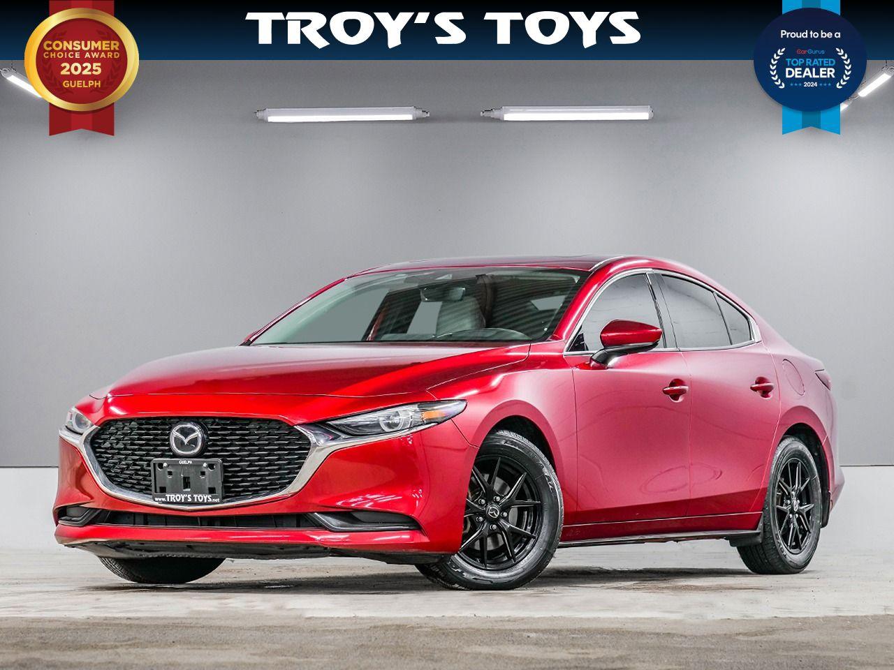 <p>Cruise into sophistication with this stunning red 2019 Mazda MAZDA3 GT, available now at Troys Toys! This sleek sedan boasts a head-turning exterior and a luxurious cream interior, offering a driving experience thats as comfortable as it is stylish. With its practical four-door design, automatic transmission, and responsive all-wheel drive, the Mazda3 GT is ready to tackle Canadian roads with confidence, whether youre navigating city streets or embarking on a weekend getaway. This beauty has 152,052km on the odometer.</p><p>The 2019 Mazda3 GT is packed with features designed to elevate your daily drive. Youll love the seamless blend of performance, technology, and design that Mazda is known for. Get ready to experience driving pleasure like never before, all while turning heads wherever you go. Come down to Troys Toys today and take it for a spin!</p><p>Here are some of the key features of this Mazda3 GT:</p><ul><li><strong>All-Wheel Drive:</strong> Conquer any weather condition with confidence and enhanced grip.</li><li><strong>Automatic Transmission:</strong> Enjoy a smooth and effortless driving experience.</li><li><strong>Luxurious Cream Interior:</strong> Experience premium comfort and style every time you get behind the wheel.</li><li><strong>Sporty Sedan Design:</strong> Turns heads wherever you go.</li><li><strong>Fuel-Efficient Gasoline Engine:</strong> Save on gas while enjoying the ride.</li></ul><p><strong><em>Powered by AutoIntelligence</em></strong> Vehicle information has been generated using artificial intelligence and is provided for informational purposes only. While efforts are made to ensure accuracy, please confirm all details directly with the dealer.</p>
