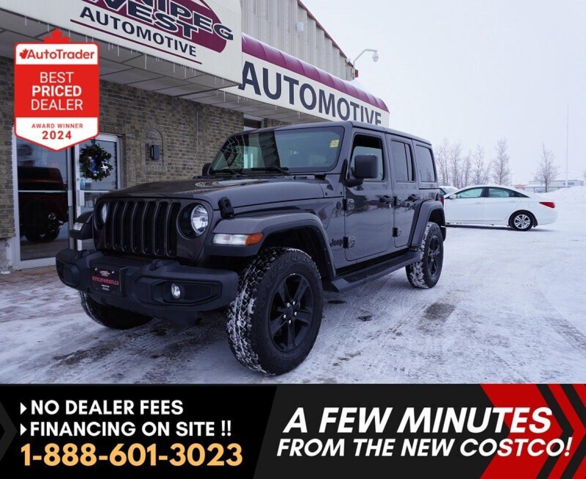 *** Dealer arranged financing on site! Quick, Simple,  no calls or waiting on bank appointments required!! Drive away today ***   NO ADMINISTRATION FEES!!
 
JUST ARRIVED! 2021 JEEP WRANGLER UNLIMITED SAHARA ALTITUDE EDITION 4X4  GRANITE CRYSTAL METALLIC  2.0L TURBO / AUTO / LEATHER / HARDTOP / HEATED SEATS & STEERING WHEEL / LIGHTING & COLD WEATHER PACKAGES & SO MUCH MORE!!!  

Absolutely stunning and exceptionally clean 2021 Jeep Wrangler Unlimited Sahara Altitude Edition 4x4, finished in premium Granite Crystal Metallic over Black leather-trimmed bucket seats. This one is loaded with factory options, combining luxury, technology, and the rugged off-road capability that made the Wrangler legendary. A perfect balance of everyday comfort and Jeep toughness  Great power & fuel economy with the all new 2.0L turbo 4cyl and looks incredible, drives beautifully, and turns heads everywhere it goes!

 POWERTRAIN & PERFORMANCE

- 2.0L DOHC Turbocharged 4-Cylinder  Direct Injection for great power and efficiency (produces 270 horsepower and 295 lb-ft of torque)
- 8-Speed TorqueFlite&reg; Automatic Transmission  smooth, responsive, and reliable
- Selec-Trac&reg; Full-Time 4WD System with 2.72:1 low range (premium upgrade)
- Trac-Lok&reg; Limited-Slip Rear Differential for added traction in snow or off-road
- Heavy-Duty 4-Wheel Disc ABS Brakes
- Trailer Sway Control, Hill Start Assist, and Electronic Stability Control
- Skid Plates (fuel tank, transmission & transfer case)
- Tow Hooks (2 Front / 1 Rear)  true Jeep capability

INTERIOR LUXURY & COMFORT

- Black Leather-Trimmed Bucket Seats with contrast stitching
- Heated Front Seats & Heated Steering Wheel (Cold Weather Group)
- Remote Start System  start it from the comfort of your home 
- Dual-Zone Automatic Climate Control
- Push-Button Start & Proximity Keyless Entry
- Leather-Wrapped Steering Wheel, Shift Knob & Parking Brake Handle
- 7-Inch Full-Color Driver Information Display
- 115V Power Outlet + Multiple USB / AUX Ports
- Universal Garage Door Opener
- Mopar&reg; Premium Headliner  extra insulation and quiet comfort

INFOTAINMENT & TECHNOLOGY

- Uconnect&reg; Touchscreen with 7 Display
- Apple CarPlay&reg; & Android Auto Compatibility
- Bluetooth&reg; Hands-Free with Voice Command
- SiriusXM&reg; Satellite Radio with 1-Year Subscription Included
- 8-Speaker Premium Audio System with Overhead Sound Bar
- Steering Wheel-Mounted Audio & Cruise Controls

SAFETY & SECURITY

- ParkView&reg; Rear Back-Up Camera
- Advanced Multistage Front Airbags
- Supplemental Front Seat-Mounted Side Airbags
- Electronic Roll Mitigation
- Tire Pressure Monitoring System (TPMS)
- Security Alarm System
- Child Seat Anchor System (LATCH)

EXTERIOR STYLE & LIGHTING PACKAGE

- Granite Crystal Metallic Exterior Paint
- Lighting Group (22L)  upgraded LED headlamps, taillamps, and fog lamps
- 18 Gloss Black Aluminum Wheels
- Body-Color 3-Piece Freedom Hardtop with storage bag
- Gloss Black Front Grille Inserts & Body-Color Integrated Front Bumper
- P255/70R18 BSW All-Terrain Tires
- Rear Window Defroster and Wiper/Washer
- Classic Jeep Styling with Modern LED Accents

FACTORY OPTIONS & PACKAGES INCLUDED

- Granite Crystal Metallic Paint
- Lighting Group (22L)
- Cold Weather Group 
- Selec-Trac&reg; Full-Time 4WD
- Trac-Lok&reg; Rear Differential
- 8-Speed Automatic Transmission 
- Proximity Keyless Entry
- Total factory upgrades: over $8,000 in options!

SUMMARY

- 2021 Jeep Wrangler Unlimited Sahara 4x4
- Engine: 2.0L Turbo 4-Cylinder
- Transmission: 8-Speed Automatic
- Drivetrain: 4x4 (Selec-Trac&reg; Full-Time System)
- Color: Granite Crystal Metallic
- Interior: Black Leather

This Sahara offers everything you could want luxury, technology, performance, and the unmistakable Jeep presence. The Granite Crystal Metallic finish looks stunning in any light, and the Lighting Group gives it a modern, upscale look. Combine that with heated leather, remote start, and full-time 4WD, and youve got the ultimate year-round adventure SUV. Whether youre tackling trails, cruising the city, or heading out for a weekend getaway this Wrangler does it all in style. 

Comes with a Manitoba Safety Certification, and we have many Extended Powertrain warrantys available on your vehicle purchase up to 10-year coverage (on eligible vehicles see dealer for details). Financing on site with Zero down financing OAC. Trades accepted. View at Winnipeg West Automotive Group, 5195 Portage Ave. (only a couple of minutes past the new Costco) Dealer permit # 6007, Call now 1(888) 601-3023. This Car is located in Winnipeg Manitoba,  however we can have it shipped anywhere in North America relatively inexpensively.