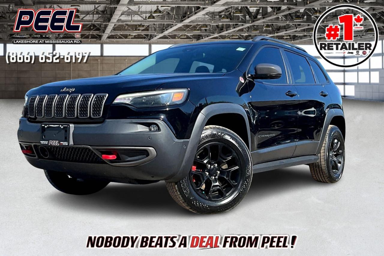 COME SEE WHY NOBODY BEATS A DEAL FROM PEEL! Your Source for ALL make and models used cars and trucks. Canadas #1 Stellantis Retailer for 9 years & counting!!

2019 Jeep Cherokee Trailhawk L Plus 4X4 | 3.2L V6 | Diamond Black Crystal Pearl | LOADED | Heated & Ventilated Nappa Leather Bucket Seats | Dual-pane Panoramic Sunroof | Uconnect 8.4" Touchscreen Display w/ Navigation | Alpine Premium Audio System | SafetyTec Group | Technology Group | Heated Steering Wheel | Remote Start | Trailer Tow Group | Adaptive Cruise Control | Lane Keep Assist | Forward Collision Warning | Blind Spot Monitoring | Parallel & Perpendicular Park Assist | Hands-free Power Liftgate | Dual-zone Automatic Climate Control | Mopar Rock Rails | Class III Hitch Receiver

Clean Carfax

Fully loaded and adventure-ready, this 2019 Jeep Cherokee Trailhawk L Plus 4X4 in Diamond Black Crystal Pearl combines premium comfort with rugged capability. Powered by the 3.2L V6, its built to handle tough trails and daily commutes alike, enhanced by Mopar rock rails, a Class III hitch receiver, and the Trailer Tow Group for added versatility. Inside, heated and ventilated Nappa leather seats, a heated steering wheel, dual-zone automatic climate control, and remote start ensure year-round comfort, while the dual-pane panoramic sunroof adds an open, airy feel. The Uconnect 8.4-inch touchscreen with navigation, Apple CarPlay, Android Auto, and an Alpine Premium Audio System keeps you connected and entertained, while the SafetyTec and Technology Groups bring advanced safety features like adaptive cruise control, lane keep assist, forward collision warning, blind spot monitoring, and parallel and perpendicular park assist. A hands-free power liftgate adds everyday convenience, rounding out a long list of premium features. With a Clean Carfax and exceptional equipment, this Trailhawk L Plus is the ideal choice for those who want luxury, technology, and legendary Jeep off-road capability in one rugged package.
______________________________________________________

Engage & Explore with Peel Chrysler: Whether youre inquiring about our latest offers or seeking guidance, 1-866-652-6197 connects you directly. Dive deeper online or connect with our team to navigate your automotive journey seamlessly.

WE TAKE ALL TRADES & CREDIT. WE SHIP ANYWHERE IN CANADA! OUR TEAM IS READY TO SERVE YOU 7 DAYS!
______________________________________________________
Our advertised prices are for consumers (i.e end users) only. 

*FREE CarFax (click the link above to check it out at no cost to you!)*

*FULLY CERTIFIED! (Have you seen some of these other dealers stating in their advertisements that certification is an additional fee? NOT HERE! Our certification is already included in our low sale prices to save you more!)

______________________________________________________

Peel Chrysler  A Trusted Destination: Based in Port Credit, Ontario, we proudly serve customers from all corners of Ontario and Canada including Toronto, Oakville, North York, Richmond Hill, Ajax, Hamilton, Niagara Falls, Brampton, Thornhill, Scarborough, Vaughan, London, Windsor, Cambridge, Kitchener, Waterloo, Brantford, Sarnia, Pickering, Huntsville, Milton, Woodbridge, Maple, Aurora, Newmarket, Orangeville, Georgetown, Stouffville, Markham, North Bay, Sudbury, Barrie, Sault Ste. Marie, Parry Sound, Bracebridge, Gravenhurst, Oshawa, Ajax, Kingston, Innisfil and surrounding areas. On our website www.peelchrysler.com, you will find a vast selection of new vehicles including the new and used Ram 1500, 2500 and 3500. Chrysler Grand Caravan, Chrysler Pacifica, Jeep Cherokee, Wrangler and more. All vehicles are priced to sell. We deliver throughout Canada. website or call us 1-866-652-6197. 

Disclaimer Statement: At Peel Chrysler, your satisfaction is our priority. While many pre-owned vehicles originally come with two keys, variations may occur based on trade-ins, and all Peel Chrysler Pre-Owned Vehicles come standard with one key. Any extras provided by the previous owner will be included with your purchase, and additional keys can be bought at the time of sale. Online prices and payments are for finance purchases. Used vehicles that are being financed are subject to a $499 (^$1500 non-prime) financing fee, while cash purchases (certified cheque, bank draft, or wire transfer) on used vehicles have a $2,000 surcharge ( online price + $2,000). Cash purchases of new vehicles only incur applicable taxes and licensing fees, and those priced above $100,000 (including accessories or add-ons) are subject to a federal luxury tax. Optional finance and lease terms are available, and if trading in a vehicle with an outstanding loan balance requiring Peel Chrysler to facilitate the lien payout, a Lien Payout Fee of $349 applies. Prices, rates, and payments are subject to change without notice. While we strive for accuracy, occasional technical or human errors may occur, so we encourage verifying all vehicle details, including features, options, materials, and specifications, with a Peel Chrysler representative by contacting us or visiting our dealership. Experience seamless convenience with our nationwide delivery options. Visit our website or contact us for more details.