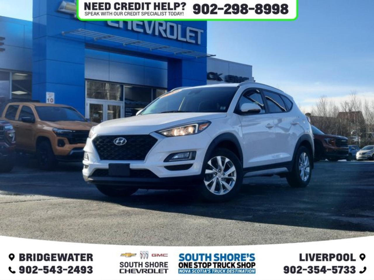 Recent Arrival! Crystal White 2020 Hyundai Tucson Preferred For Sale, Bridgewater AWD 6-Speed Automatic with Overdrive 2.0L 4-Cylinder Clean Car Fax, AWD, 6 Speakers, ABS brakes, Air Conditioning, Alloy wheels, Brake assist, Delay-off headlights, Driver door bin, Driver vanity mirror, Dual front side impact airbags, Electronic Stability Control, Exterior Parking Camera Rear, Front anti-roll bar, Front Bucket Seats, Front fog lights, Front reading lights, Fully automatic headlights, Heated door mirrors, Heated Front Bucket Seats (3-Steps), Heated front seats, Heated rear seats, Illuminated entry, Occupant sensing airbag, Outside temperature display, Overhead console, Power door mirrors, Power steering, Power windows, Radio: AM/FM/MP3 Audio System, Rear window defroster, Remote keyless entry, Roof rack: rails only, Security system, Speed control, Steering wheel mounted audio controls, Tachometer, Telescoping steering wheel, Traction control, Trip computer, Turn signal indicator mirrors, Variably intermittent wipers. Reviews: * Most owners say this era of Tucson attracted their attention with unique exterior styling, and sealed the deal with a great balance of comfortable ride quality and sporty, spirited driving dynamics. Bang-for-the-buck was highly rated as well. Source: autoTRADER.ca