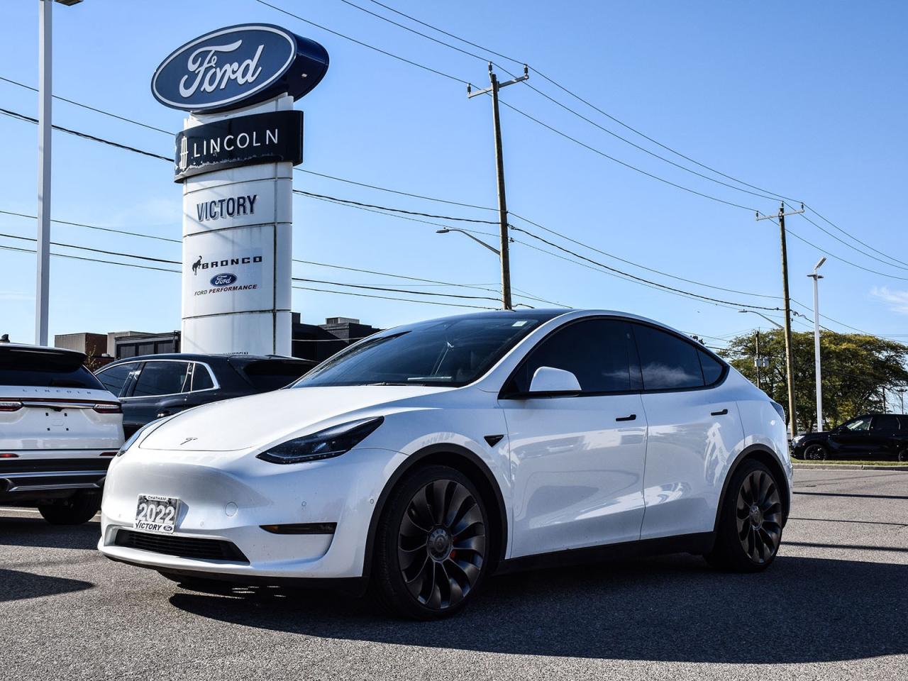 <p><strong>NOW AVAILABLE AT VICTORY LINCOLN</strong></p>

<p>???????????????????????????????????????</p>

<p><strong>2022 TESLA MODEL Y PERFORMANCE</strong></p>

<p><br />
Dual Motor AWD | Long Range | Premium Interior | Advanced Autopilot Capability</p>

<p>Experience pure electric performance with the 2022 Tesla Model Y Performance  the ultimate combination of speed, technology, and everyday practicality. This all-electric SUV delivers incredible acceleration, long-range efficiency, and cutting-edge safety in a refined, minimalist design.</p>

<p>???????????????????????????????????????</p>

<p><strong>POWER & PERFORMANCE</strong><br />
? Dual Electric Motors with Performance AWD<br />
? 0100 km/h in Just 3.7 Seconds<br />
? 456 HP (Equivalent Output)<br />
? Estimated Range: Up to 488 km (Performance Model, per NRCan)<br />
? Sport-Tuned Suspension & Performance Brakes<br />
? 21 Überturbine Wheels<br />
? Track Mode with Dynamic Torque Vectoring</p>

<p>???????????????????????????????????????</p>

<p><strong>INTERIOR & TECHNOLOGY</strong><br />
 15 Tesla Touchscreen Display with Over-the-Air Software Updates<br />
 Premium Audio System with 13 Speakers<br />
 Panoramic All-Glass Roof<br />
 Heated Front & Rear Seats<br />
 Heated Steering Wheel<br />
 Wireless Charging for Dual Smartphones<br />
 Voice-Activated Controls & Customizable Driver Profiles</p>

<p>???????????????????????????????????????</p>

<p><strong>SAFETY & DRIVER ASSIST</strong><br />
? Tesla Autopilot with Advanced Driver Assistance<br />
? Adaptive Cruise Control<br />
? Automatic Emergency Braking<br />
? Lane Departure Avoidance & Lane Keeping Assist<br />
? Blind Spot Monitoring with Side Collision Warning<br />
? 360° Cameras with Front/Rear/Side View<br />
? Over-the-Air Safety Feature Updates</p>

<p>???????????????????????????????????????</p>

<p><strong>EXTERIOR DESIGN</strong><br />
? Sleek Aerodynamic Profile with Performance Rear Spoiler<br />
? LED Headlights & Taillights<br />
? Power Liftgate<br />
? Frameless Doors with Flush Handles<br />
? Minimalist Design for Enhanced Efficiency</p>

<p>???????????????????????????????????????</p>

<hr />
<p><strong>Special Offer:</strong><br />
Financing Special: Listed price available on approved credit for financed purchases. Pricing may vary with alternative payment methods.</p>

<p><strong>Peace of Mind Included:</strong><br />
? 3-Month Comprehensive Warranty (for vehicles under 10 years old & under 160,000 km)<br />
? No-Haggle, Live Market Pricing  Transparent & Competitive<br />
? All-Inclusive Pricing: Fees, Reconditioning, and Full Detailing Included (Taxes & Licensing Extra)</p>

<hr />
<p><strong>Additional Details:</strong><br />
 Keys: Standard with one key card. Additional cards (if provided by the previous owner) included at no cost. Optional replacements available upon request.</p>

<p>Visit Victory Ford Lincoln Today<br />
Schedule your appointment to experience this exceptional vehicle.</p>