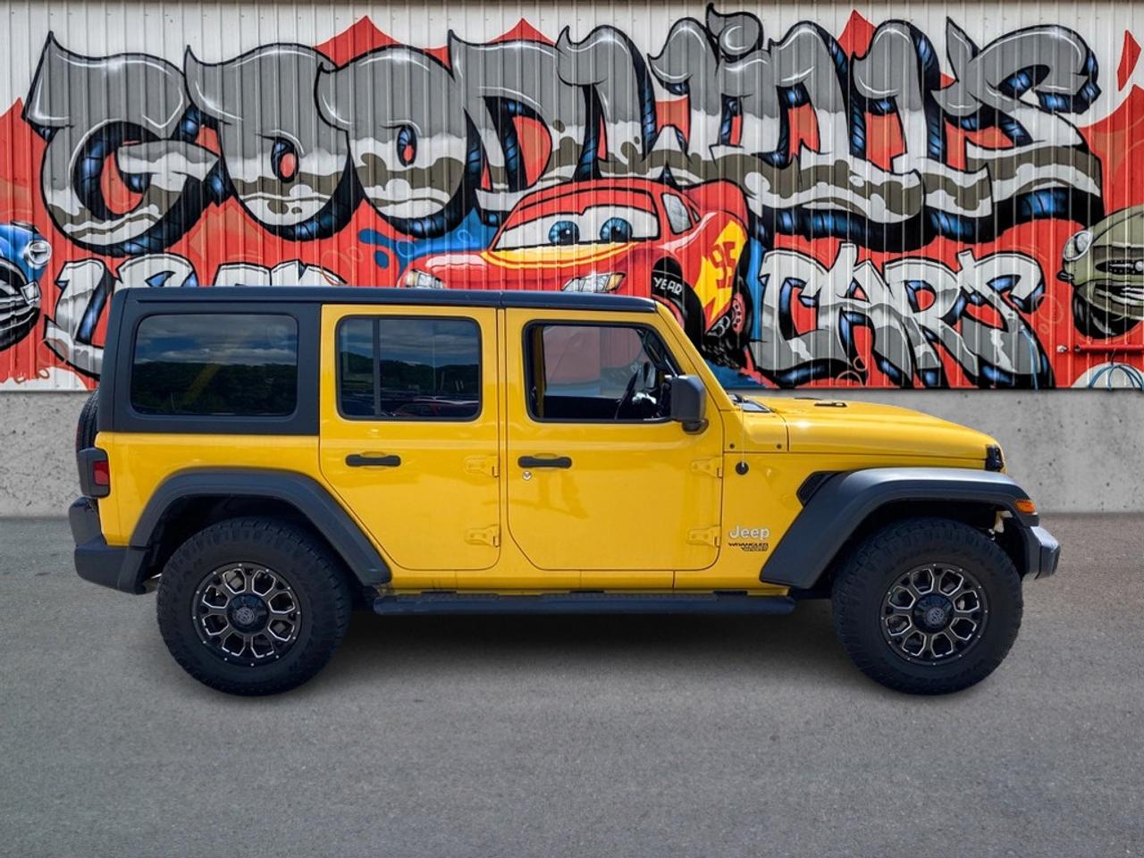 The 2021 Jeep Wrangler Unlimited Sport is a legendary off-road SUV designed for adventure lovers who want both fun and function. Featuring a 2.0L turbocharged 4-cylinder engine and a capable 4-wheel drive system, its made to tackle everything from rough trails to city streets. This four-door model seats five across two rows and comes with essential safety features including ABS, Electronic Stability Control, Traction Control, and a Backup Camera. Side and front airbags provide added protection for passengers. With its iconic open-body design and rugged engineering, the 2021 Wrangler Unlimited Sport brings trail-ready performance and daily driving utility together like no other.

REMOTE START, BACK UP CAMERA, BACK UP SENSOR, APPLE/ ANDROID CARPLAY! APPLY ONLINE FOR PREAPPROVAL ON FINANCING TODAY Low bank financing rates! Good or bad credit welcome. Let us help restore your credit history. In house financing available as well at reasonable rates! Easy online credit application 24/7 on our website. We have over 250 quality pre-owned vehicles in stock at all times with fresh units arriving daily! Click our banner to view our entire inventory. Buy with confidence when you shop at Goodwills . We are a family owned business serving the community and many other cities such as Kitchener, London, St. Thomas, Tillsonburg, Cambridge, Guelph, Mississauga, Hamilton, Brantford, Oakville, Ingersoll and Woodstock. Vehicle history reports are always available and we are a full disclosure dealer. We service what we sell in our large six bay service shop. Our vehicles are certified and detailed. Of course trade-ins are always welcome. We thank you for your consideration at Goodwills, where you will find big city selection at small town pricing. All prices are plus HST and LICENSING