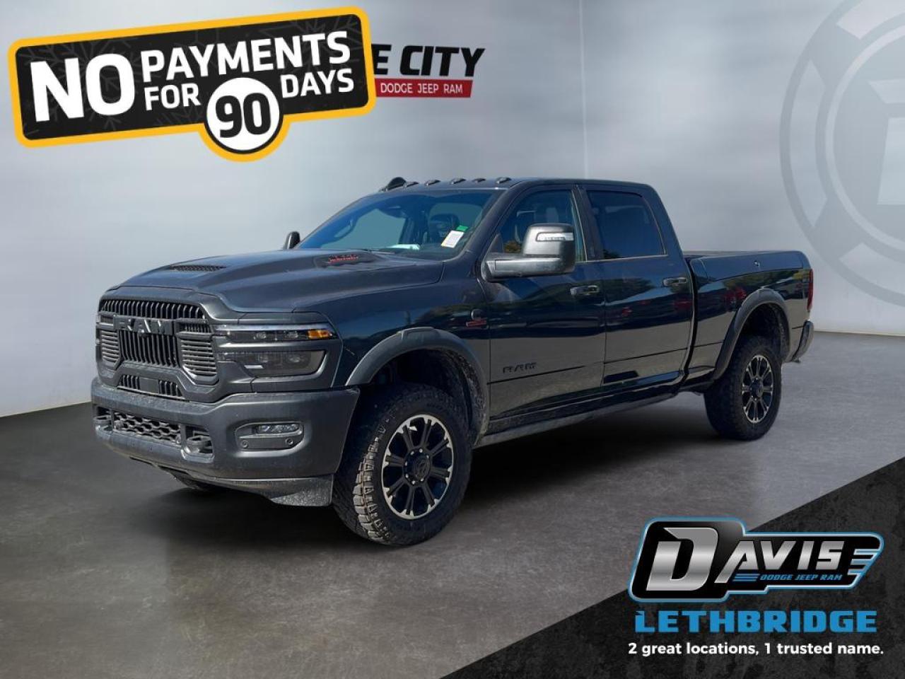 <b>Adaptive Cruise, Navigation, Heated Seats, Blind Spot Detection, Remote Start, Heated Steering Wheel!<br /> <br /></b><br /> <br /> <br />Conquer any terrain with the 2026 Ram 2500 Rebel Crew Cab in Forged Blue Metallic with Lower Two-Tone Paint. Powered by the 6.7L Cummins Turbo Diesel I6 engine paired with an 8-speed TorqueFlite HD automatic transmission and 4x4 Rebel Performance Suspension, this heavy-duty truck delivers rugged capability with trailering, off-road, and work-ready performance.<br /><br />The exterior impresses with 20 Black Diamond-Cut aluminum wheels, LT285/60R20 all-terrain tires, powder-coated bumpers, LED lighting, black wheel flares, and deployable running boards. Inside, enjoy leather-trimmed heated and ventilated bucket seats, dual-zone climate control, folding 60/40 rear seat, Uconnect 5 NAV with 14.4 touchscreen, Apple CarPlay, Android Auto, Alexa built-in, 17-speaker Harman Kardon audio, and dual wireless charging.<br /><br />Safety and convenience are enhanced with adaptive cruise control with stop, ParkView rear camera, ParkSense front/rear park assist, blind-spot monitoring with cross-path detection, Class V receiver hitch, trailer sway damping, tow hooks, and tip start. The 2026 Ram 2500 Rebel is the ultimate combination of power, luxury, and technology for work and adventure.<br /> <br />To apply right now for financing use this link: <a href=https://www.bridgecitychrysler.com/pre-approval/ target=_blank rel=nofollow noopener noreferrer>https://www.bridgecitychrysler.com/pre-approval/</a><br /><br /> <br /><br />As a premier Chrysler, Dodge, Jeep and RAM dealership, Bridge City Chrysler proudly offers an extensive selection of new and used vehicles to meet every drivers needs. Customers across Lethbridge, Fort Macleod, Taber, Claresholm, Coaldale, and beyond trust us for daily vehicle specials, certified service and parts, and a seamless online inventory experience. <br /><br /> With competitive financing options and expert support, we make car buying easy and enjoyable. <br /><br /> Ready to hit the road? Schedule your test drive today at Bridge City Chrysler, your trusted Chrysler, Dodge, Jeep and RAM dealer in Lethbridge, Alberta.<br /><br /> Vehicle pricing offer shown expires 2026-01-31. <br /> Come by and check out our fleet of 80+ used cars and trucks and 120+ new cars and trucks for sale in Lethbridge. o~o