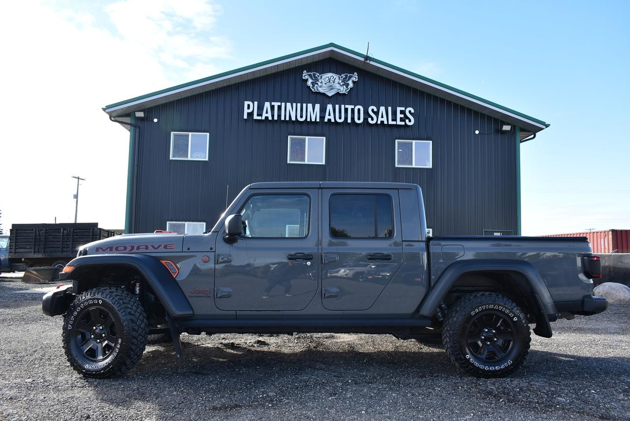 <p data-start=170 data-end=249>&nbsp;</p><p data-start=170 data-end=249>🔥 <strong data-start=173 data-end=244>FOR SALE: 2021 Jeep Gladiator Mojave &ndash; The Ultimate Desert Warrior!</strong> 🔥</p><p data-start=251 data-end=502>Built for those who crave <em data-start=277 data-end=308>freedom, grit, and adrenaline</em>, this <strong data-start=315 data-end=345>2021 Jeep Gladiator Mojave</strong> is more than just a truck &mdash; it&rsquo;s an <em data-start=382 data-end=404>off-road experience!</em> ,&nbsp;</p><p data-start=504 data-end=903>💪 <strong data-start=507 data-end=531>POWER & PERFORMANCE:</strong><br data-start=531 data-end=534>⚙️ 3.6L Pentastar V6 Engine &ndash; 285 HP / 260 lb-ft Torque<br data-start=589 data-end=592>⚙️ 8-Speed Automatic Transmission<br data-start=625 data-end=628>⚙️ 4x4 with Off-Road+ Mode<br data-start=654 data-end=657>⚙️ FOX 2.5 Internal Bypass Shocks & Hydraulic Jounce Bumpers &ndash; engineered for desert-speed durability<br data-start=759 data-end=762>⚙️ Heavy-Duty Dana 44 Axles (front & rear)<br data-start=804 data-end=807>⚙️ Locking Rear Differential & Reinforced Frame<br data-start=854 data-end=857>⚙️ 33 All-Terrain Tires on Blacked-Out Rims</p><p data-start=905 data-end=1238>🌵 <strong data-start=908 data-end=936>MOJAVE PACKAGE FEATURES:</strong><br data-start=936 data-end=939>🏜️ &ldquo;Desert Rated&rdquo; &ndash; exclusive to the Mojave trim for high-speed off-road capability<br data-start=1023 data-end=1026>🏜️ Unique Hood Design with Mojave Badging & Orange Tow Hooks<br data-start=1087 data-end=1090>🏜️ Raised Suspension & Specially Tuned Steering<br data-start=1138 data-end=1141>🏜️ Skid Plates & Rock Rails for extra protection<br data-start=1190 data-end=1193>🏜️ Rear Sliding Window & Spray-In Bedliner</p><p data-start=1240 data-end=1619>🛋️ <strong data-start=1244 data-end=1264>INTERIOR & TECH:</strong><br data-start=1264 data-end=1267>🎵 Uconnect Infotainment System with Large Touchscreen<br data-start=1321 data-end=1324>📱 Apple CarPlay & Android Auto<br data-start=1355 data-end=1358>🧭 Navigation, Bluetooth, & Backup Camera<br data-start=1399 data-end=1402>🔥 Heated Front Seats & Steering Wheel<br data-start=1440 data-end=1443>🕶️ Removable Roof Panels for that classic open-air Jeep feel<br data-start=1504 data-end=1507>🚪 Full 4-Door Crew Cab with Ample Passenger Space<br data-start=1557 data-end=1560>💡 LED Lighting Group &ndash; Headlamps, Fog Lamps & Tail Lamps</p><p data-start=1621 data-end=1789>💥 <strong data-start=1624 data-end=1659>STYLE & FUNCTION IN ONE PACKAGE</strong> 💥<br data-start=1662 data-end=1665>From the city to the sand dunes, the Gladiator Mojave turns heads everywhere it goes. It&rsquo;s rugged, refined, and 100% Jeep.</p><p data-start=1621 data-end=1789>VEHICLE HAS 198,000KM WHICH ARE HIGHWAY KMS CUSTOMER LIVES OUT TOWN AND WORKED IN ANOTHER PROVINCE THE SHAPE OF THE VEHICLE WILL SHOW YOU HOW WELL THIS VEHICLE WAS TAKEN CARE OF WONT DISAPPOINT.&nbsp;&nbsp;</p><p data-start=1791 data-end=1899>📍 <strong data-start=1794 data-end=1835>Now available at Platinum Auto Sales!</strong><br data-start=1835 data-end=1838>Come see it in person &mdash; you won&rsquo;t want to leave without it.</p><p>&nbsp;</p><p data-start=1901 data-end=2023>#JeepGladiator #MojaveEdition #PlatinumAutoSales #OffRoadBeast #TrailReady #AdventureAwaits #JeepLife #NovaApproved 🚗💨</p><pre><strong><span style=color: #3e4153; font-family: Larsseit, Arial, sans-serif; font-size: 16px; white-space: pre-line; background-color: #f8f9f9;>DEALER PERMIT # 4744<br>STOCK # 1628<br><br></span></strong><br><br><span style=color: #3e4153; font-family: Larsseit, Arial, sans-serif; font-size: 16px; white-space: pre-line; background-color: #f8f9f9;>FRESH MB SAFETY</span><br><br><span style=color: #3e4153; font-family: Larsseit, Arial, sans-serif; font-size: 16px; white-space: pre-line; background-color: #f8f9f9;>200 POINT INSPECTION SO YOU CAN BUY WITH CONFIDENCE</span><br><br><span style=color: #3e4153; font-family: Larsseit, Arial, sans-serif; font-size: 16px; white-space: pre-line; background-color: #f8f9f9;>CARFAX available</span><br><br><span style=color: #3e4153; font-family: Larsseit, Arial, sans-serif; font-size: 16px; white-space: pre-line; background-color: #f8f9f9;>LOW RATE FINANCING AVAILABLE *OAC</span><br><br><span style=color: #3e4153; font-family: Larsseit, Arial, sans-serif; font-size: 16px; white-space: pre-line; background-color: #f8f9f9;>All trades considered</span><br><br><span style=color: #3e4153; font-family: Larsseit, Arial, sans-serif; font-size: 16px; white-space: pre-line; background-color: #f8f9f9;>Extended Warranty available</span><br><br><span style=color: #3e4153; font-family: Larsseit, Arial, sans-serif; font-size: 16px; white-space: pre-line; background-color: #f8f9f9;><strong>Platinum Auto Sales </strong></span><span style=color: #3e4153; font-family: Larsseit, Arial, sans-serif;><span style=font-size: 16px; white-space: pre-line;><strong>conveniently</strong></span></span><strong style=color: #3e4153; font-family: Larsseit, Arial, sans-serif; font-size: 16px; white-space: pre-line;>&nbsp;located off the East Perimeter Hwy at our NEW LOCATION 240 TRANSPORT RD!</strong></pre><pre><br><span style=color: #3e4153; font-family: Larsseit, Arial, sans-serif; font-size: 16px; white-space: pre-line; background-color: #f8f9f9;>THE MPI TIRE PROGRAM IS AVAILABLE MSG FOR DETAILS</span><br><br><span style=color: #3e4153; font-family: Larsseit, Arial, sans-serif; font-size: 16px; white-space: pre-line; background-color: #f8f9f9;>MPI GLASS DIRECT REPAIR/REPLACEMENT</span><br><br><span style=color: #3e4153; font-family: Larsseit, Arial, sans-serif; font-size: 16px; white-space: pre-line; background-color: #f8f9f9;>Open 6 days a week Mon-Friday 9-6 Sat 9-4</span><br><br><strong><span style=color: #3e4153; font-family: Larsseit, Arial, sans-serif; font-size: 16px; white-space: pre-line; background-color: #f8f9f9;>REMEMBER THERES NO BETTER DEAL THEN A PLATINUM DEAL!</span></strong><br><br><br><br><br><span style=color: #3e4153; font-family: Larsseit, Arial, sans-serif; font-size: 16px; white-space: pre-line; background-color: #f8f9f9;>Disclaimer: Please call dealership for availability. Price excludes taxes. Accepted payment methods: Cash, Debit, Certified Cheque, Bank Draft & Credit Cards(surcharge applies to all credit card purchases over $1000).</span></pre>