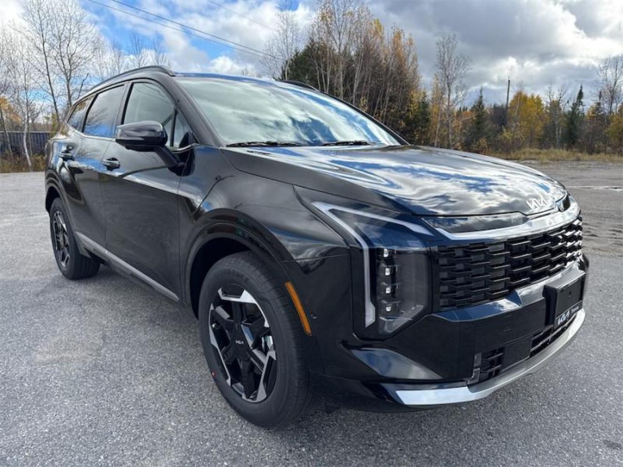 <b>Harmon/Kardon Premium Sound System, Navigation GPS, Heated Steering Wheel, Heads-Up Display,  360 Camera, Air Cooled Front Seats, Dual Power Seats, Lane Keep Assist, Blind Spot Detection and much more! <br> <br></b><br>  <br> <br>  This 2026 Kia Sportage Hybrid comes loaded with great standard features and equipment, compared to its rivals. <br> <br>This 2026 Kia Sportage Hybrid reimagines innovation in motion. It pushes the boundaries of urban SUV design and technology with refinement and purpose, while delivering all the comforts and connectivity modern adventures require. With engaging dynamics, unrivaled capability and superior efficiency, this SUV really leaves no stone unturned.<br> <br> This fusion black SUV  has a 6 speed automatic transmission and is powered by a  232HP 1.6L 4 Cylinder Engine.<br> <br> Our Sportage Hybrids trim level is SX AWD w/Black Interior. This hybrid SUV blends turbocharged power with electric efficiency and all-wheel drive for smooth performance, confident traction, and impressive fuel economy. Its refined design stands out with LED lighting, 18-inch alloy wheels, and a panoramic sunroof for a premium, modern look. Inside, comfort meets technology with heated and ventilated front seats with memory settings, a heated leather steering wheel, dual-zone automatic climate control, and a 12.3-inch touchscreen with navigation, Harman Kardon audio, and full smartphone integration. Advanced driver-assistance features include Highway Driving Assist 2, Smart Cruise Control, Blind-Spot Collision Avoidance, and a surround-view camera system. Remote Smart Parking Assist and other convenience technologies make every journey safer and easier. This vehicle has been upgraded with the following features: Premium Audio,  Hud,  360 Camera,  Cooled Seats,  Navigation,  Sunroof,  Power Liftgate. <br><br> <br>To apply right now for financing use this link : <a href=https://www.kiaoftimmins.com/timmins-ontario-car-loan-application target=_blank>https://www.kiaoftimmins.com/timmins-ontario-car-loan-application</a><br><br> <br/> See dealer for details. <br> <br>As a local, family owned and operated dealership we look to be your number one place to buy your new vehicle! Kia of Timmins has been serving a large community across northern Ontario since 2001 and focuses highly on customer satisfaction. Our #1 priority is to make you feel at home as soon as you step foot in our dealership. Family owned and operated, our business is in Timmins, Ontario the city with the heart of gold. Also positioned near many towns in which we service such as: South Porcupine, Porcupine, Gogama, Foleyet, Chapleau, Wawa, Hearst, Mattice, Kapuskasing, Moonbeam, Fauquier, Smooth Rock Falls, Moosonee, Moose Factory, Fort Albany, Kashechewan, Abitibi Canyon, Cochrane, Iroquois falls, Matheson, Ramore, Kenogami, Kirkland Lake, Englehart, Elk Lake, Earlton, New Liskeard, Temiskaming Shores and many more.We have a fresh selection of new & used vehicles for sale for you to choose from. If we dont have what you need, we can find it! All makes and models are within our reach including: Dodge, Chrysler, Jeep, Ram, Chevrolet, GMC, Ford, Honda, Toyota, Hyundai, Mitsubishi, Nissan, Lincoln, Mazda, Subaru, Volkswagen, Mini-vans, Trucks and SUVs.<br><br>We are located at 1285 Riverside Drive, Timmins, Ontario. Too far way? We deliver anywhere in Ontario and Quebec!<br><br>Come in for a visit, call 1-800-661-6907 to book a test drive or visit <a href=https://www.kiaoftimmins.com>www.kiaoftimmins.com</a> for complete details. All prices are plus HST and Licensing.<br><br>We look forward to helping you with all your automotive needs!<br><br> Come by and check out our fleet of 20+ used cars and trucks and 30+ new cars and trucks for sale in Timmins.  o~o
