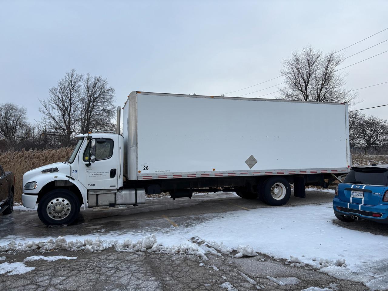 Work-Ready 2004 Freightliner M2 Diesel | 7.2L Caterpiller Engine | VALID SAFETY | High-Capacity Box with Power Liftgate<br><br>Expand your fleet without breaking the bank. This 2004 Freightliner M2 is a proven workhorse that combines a high-capacity box with the convenience of a power liftgate. Its the perfect solution for local deliveries, moving services, or mobile storage.<br><br>Why Youll Love It:<br><br>Ready to Haul: The spacious 26ft+ dry van body handles big loads with ease.<br>Work Smarter: Equipped with a hydraulic rear liftgate to make loading heavy appliances or pallets safe and efficient.<br>Professional Look: Features a clean white exterior that is ready for your company decals, plus a Medium Deluxe cab with a chrome grille and polished mirrors that look great on the road.<br><br>Driver Comfort: The M2 chassis offers excellent visibility and a tight turning radius, making it easier to navigate city streets than older style trucks.<br><br>Transparency & Condition: We believe in fair pricing and total transparency. To offer you the lowest possible price, we are selling this truck As-Is (Uncertified).<br><br>The Opportunity: By purchasing the vehicle uncertified you can can choose your own trusted mechanic to perform the safety inspection.<br><br>Condition: The truck runs and drives strong. As expected for the year, there is some cosmetic wear and typical surface aging on the undercarriage, but the bones of the truck offer solid potential.