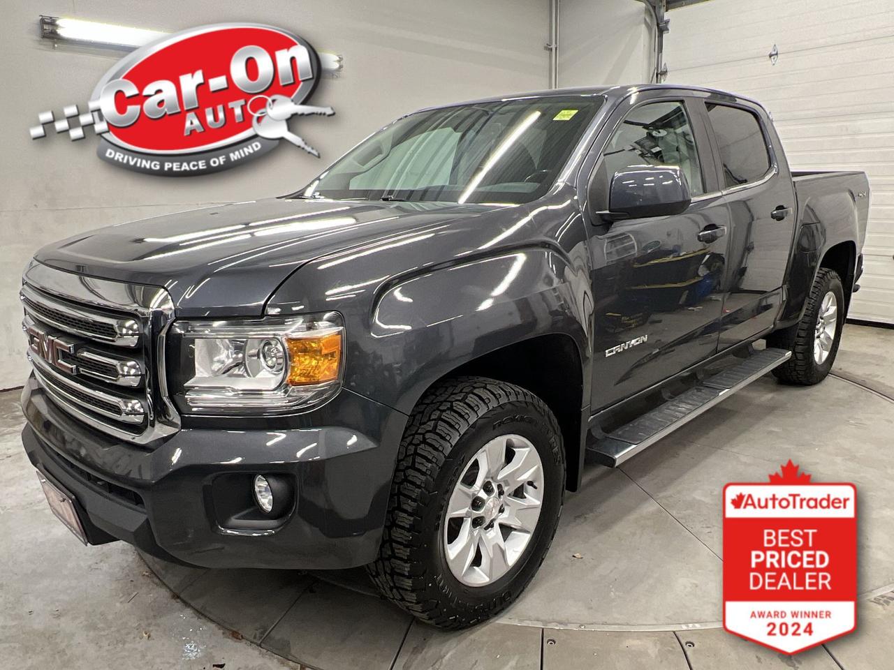 ONLY 93,000KMS!! 4X4 SLE CREW CAB W/ 3.6L V6! Backup camera, remote start, Android Auto/ Apple CarPlay, automatic headlights, automatic climate control, keyless entry, power mirrors, power windows, power locks, 17-inch alloys, running boards, tow package, 5-foot 2-inch bed w/ spray-in bedliner, leather-wrapped steering, cruise control, Bluetooth and Sirius XM!!