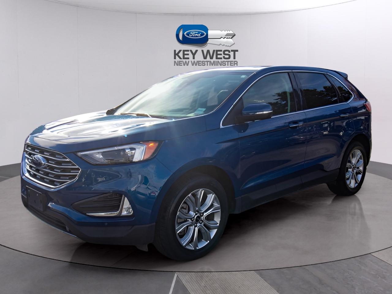 <p>Looking for a stylish and capable SUV that can handle any adventure? Check out this stunning blue 2023 Ford Edge Titanium AWD, available now at Key West Ford! This sleek crossover offers a perfect blend of performance and practicality, making it an ideal choice for families and individuals alike. With only 64,045 km on the odometer, this Edge is ready to provide you with years of reliable driving pleasure.</p><p>The Ford Edge Titanium AWD boasts an array of impressive features designed to enhance your driving experience. Its all-wheel-drive system ensures confident handling in all weather conditions, while the automatic transmission provides smooth and effortless shifting. This SUV is a true head-turner.</p><p>Here are five features that make this 2023 Ford Edge Titanium AWD truly stand out:</p><ul><li><strong>Panoramic Vista Roof:</strong> Soak in the sunshine and open up the cabin with the expansive panoramic roof, perfect for scenic drives.</li><li><strong>Luxurious Leather Interior:</strong> Sink into the comfort of premium leather seats, offering a refined and comfortable driving experience.</li><li><strong>Advanced Driver-Assistance Technologies:</strong> Stay safe and secure with a suite of cutting-edge driver-assist features, including adaptive cruise control and lane-keeping assist.</li><li><strong>SYNC&reg; 4 Infotainment System:</strong> Enjoy seamless connectivity with the intuitive SYNC&reg; 4 system, featuring a large touchscreen display, Apple CarPlay, and Android Auto compatibility.</li><li><strong>B&O Sound System:</strong> Experience your favourite music in a whole new way with the immersive B&O sound system.</li></ul><p><strong><em>Powered by AutoIntelligence&trade;</em></strong> Vehicle information has been generated using artificial intelligence and is provided for informational purposes only. While efforts are made to ensure accuracy, please confirm all details directly with the dealer.</p><p>Experience peace of mind with our Buy With Confidence program! This vehicle comes with a 30-day/2,000 km exchange, a complimentary 6-month powertrain warranty (if the factory powertrain warranty has expired, personal-use vehicles only), comprehensive mechanical and safety inspection, Carfax report, and full disclosure. We are committed to transparent pricing. The advertised price excludes fees: $699 Documentation, $349 Registration/Insurance Transfer, $695 Finance Administration Fee (if applicable), and taxes. As BCs #1 Volume Dealer and #1 for Customer Experience on DealerRater, we prioritize your satisfaction. See Key West Ford for complete details. Book your test drive today!&nbsp; Dealer #7485</p>