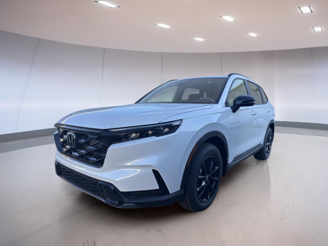 Experience the future of driving with the brand new 2026 Honda CR-V Hybrid Sport, available now at Moose Jaw Honda in Moose Jaw. This innovative SUV blends advanced hybrid technology with all-wheel drive capability, offering exceptional efficiency and performance. With a striking white exterior and a sleek black interior, this CR-V Hybrid Sport stands out on any road.

FEATURES OF THE CR-V Hybrid Sport  
»» 2.0L 16-valve DOHC 4-cylinder hybrid engine  
»» Electro-Continuously Variable Transmission for smooth acceleration  
»» Real Time All-Wheel Drive for confident traction  
»» Distinctive Sport trim styling and accents  

ADVANCED SAFETY FEATURES  
»» Honda Sensing suite with adaptive cruise control  
»» Collision Mitigation Braking System for added protection  
»» Lane Keeping Assist to help stay centred  
»» Road Departure Mitigation for enhanced security  

PERFORMANCE AND EFFICIENCY  
»» Hybrid powertrain for impressive fuel savings  
»» 2.0L engine with dual variable valve timing  
»» Electro-Continuously Variable Transmission for seamless shifts  
»» All-wheel drive for optimal grip in all conditions  

COMFORT AND CONVENIENCE  
»» Dual-zone automatic climate control for personalized comfort  
»» Spacious cabin with flexible seating arrangements  
»» Heated front seats for cold Canadian mornings  
»» Push-button start for effortless entry and ignition  

TECHNOLOGY AND CONNECTIVITY  
»» 7-inch touchscreen display for easy access  
»» Apple CarPlay and Android Auto integration  
»» Bluetooth HandsFreeLink for safe communication  
»» USB charging ports for all your devices  

CARGO SPACE  
»» Generous rear cargo area for daily needs  
»» Split-folding rear seats for added versatility  
»» Low lift-over height for easy loading  
»» Hidden storage compartments for extra organization  

WHAT OTHER OWNERS LIKE  
»» Excellent hybrid fuel efficiency in city and highway  
»» Smooth and quiet ride quality  
»» User-friendly infotainment and connectivity features  
»» Spacious interior with ample cargo space  

This 2026 Honda CR-V Hybrid Sports VIN is: 2HKRS6H51TH217908.<p> available now at Moose Jaw Honda in Moose Jaw. This innovative SUV blends advanced hybrid technology with all-wheel drive capability</p>
<p> offering exceptional efficiency and performance. With a striking white exterior and a sleek black interior</p>
<p> this CR-V Hybrid Sport stands out on any road.

FEATURES OF THE CR-V Hybrid Sport  
»» 2.0L 16-valve DOHC 4-cylinder hybrid engine  
»» Electro-Continuously Variable Transmission for smooth acceleration  
»» Real Time All-Wheel Drive for confident traction  
»» Distinctive Sport trim styling and accents  

ADVANCED SAFETY FEATURES  
»» Honda Sensing suite with adaptive cruise control  
»» Collision Mitigation Braking System for added protection  
»» Lane Keeping Assist to help stay centred  
»» Road Departure Mitigation for enhanced security  

PERFORMANCE AND EFFICIENCY  
»» Hybrid powertrain for impressive fuel savings  
»» 2.0L engine with dual variable valve timing  
»» Electro-Continuously Variable Transmission for seamless shifts  
»» All-wheel drive for optimal grip in all conditions  

COMFORT AND CONVENIENCE  
»» Dual-zone automatic climate control for personalized comfort  
»» Spacious cabin with flexible seating arrangements  
»» Heated front seats for cold Canadian mornings  
»» Push-button start for effortless entry and ignition  

TECHNOLOGY AND CONNECTIVITY  
»» 7-inch touchscreen display for easy access  
»» Apple CarPlay and Android Auto integration  
»» Bluetooth HandsFreeLink for safe communication  
»» USB charging ports for all your devices  

CARGO SPACE  
»» Generous rear cargo area for daily needs  
»» Split-folding rear seats for added versatility  
»» Low lift-over height for easy loading  
»» Hidden storage compartments for extra organization  

WHAT OTHER OWNERS LIKE  
»» Excellent hybrid fuel efficiency in city and highway  
»» Smooth and quiet ride quality  
»» User-friendly infotainment and connectivity features  
»» Spacious interior with ample cargo space  

This 2026 Honda CR-V Hybrid Sports VIN is: 2HKRS6H51TH217908.</p>