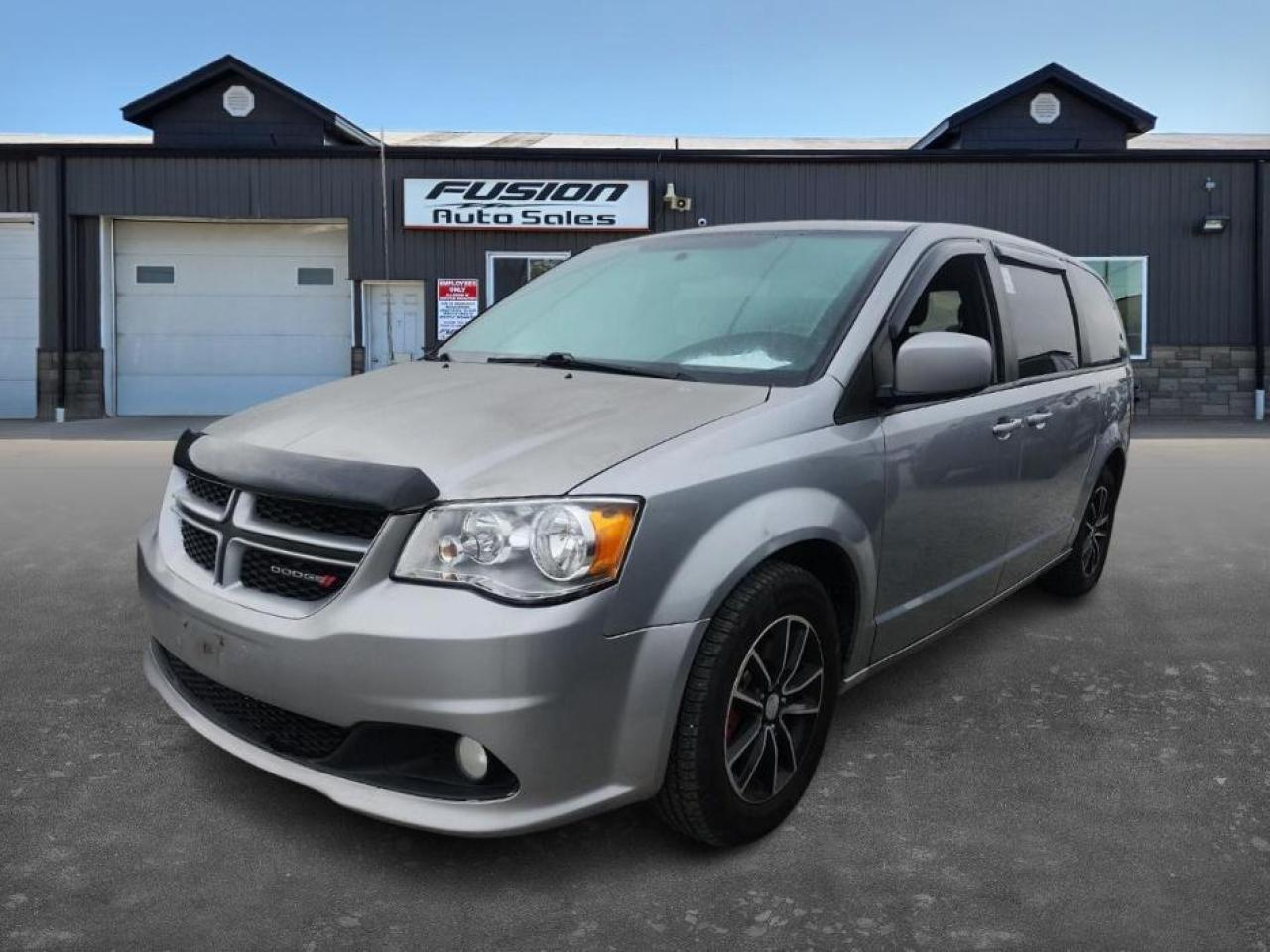<p>Looking for a spacious and versatile vehicle thats perfect for family adventures? Check out this used 2018 Dodge Grand Caravan GT, now available at Fusion Auto Sales! This stylish minivan is ready to take on anything your busy life throws its way, offering a comfortable and practical ride for everyone. With a sleek silver exterior and a luxurious black leather interior, this Grand Caravan GT exudes both sophistication and functionality. Plus, with a reliable 3.6L V6 engine under the hood, you can be sure you will have the power when you need it. This Grand Caravan GT has 175,529km on the odometer.</p><p>This well-equipped Grand Caravan GT boasts a variety of features designed to enhance your driving experience. The automatic transmission makes for smooth and effortless shifts, while the front-wheel-drive system ensures confident handling in various road conditions. This minivan has a lot to offer and is waiting for you to get behind the wheel.</p><p>Here are five stand-out features of this 2018 Dodge Grand Caravan GT:</p><ul><li><strong>Luxurious Black Leather Interior:</strong> Sink into the comfort and style of the premium leather seats, creating a refined and inviting cabin.</li><li><strong>Powerful 3.6L V6 Engine:</strong> Experience responsive performance and the confidence to take on any journey.</li><li><strong>Versatile Minivan Design:</strong> Enjoy the ultimate in passenger and cargo flexibility, perfect for all your needs.</li><li><strong>Automatic Transmission:</strong> Experience seamless gear changes and a relaxed driving experience.</li><li><strong>Spacious Interior:</strong> This Grand Caravan is perfect for busy families.</li></ul><p><strong><em>Powered by AutoIntelligence™</em></strong> Vehicle information has been generated using artificial intelligence and is provided for informational purposes only. While efforts are made to ensure accuracy, please confirm all details directly with the dealer.</p><p>The Fusion Philosophy<br /><br />At Fusion Auto Sales, we put more effort into buying our vehicles than we do trying to sell them. By constantly monitoring what other car lots are doing, we strive to be the lowest priced dealer in our market. We won’t purchase a vehicle to “fill a hole”. We know that the vehicles on our lot are great value for the money and smart shoppers realize that also. Adhering to this philosophy makes it easy for our customers. If they find a vehicle on our lot that fulfills their needs and wants, they know that they’re getting great value. <br /><br />If we don’t have what you’re looking for, we can find it! Over 150 customers have saved thousands of dollars buy joining our” locate club”. People that know what they want and what they want to pay (within reason of course), get the vehicle of their dreams and enjoy huge savings. Contact us for details.<br /><br /><br /><br />Fusion Auto Sales is in Tilbury, Ont. located between Windsor and London right off the 401. We are among 7 dealerships within a &frac12; kilometer distance which is great for out of town shoppers. We began satisfying customers in 2009 and have been doing so ever since. In 2012 Fusion was recognized as 1 of the 50 fastest growing companies in Canada. And then, in 2018, we were named one of the top 5 independent automobile dealerships in the country. <br /><br />We specialize in late model vehicles at below than average pricing, everything is fully certified and every unit is Car Proof verified and is fully disclosed with every unit. We offer every type of financing from perfect credit at great rates to credit challenges with competitive rates. We also specialize in locating vehicles for customers, we cant have everything on the lot so if you do not see it and are having a hard time finding what you are looking for, let us know and we can find it for you. Fusion Auto Sales spans its customer base from Windsor all the way to Timmins, On and every where in between. Our philosophy is You are going to like the way we deal and everyone does, straight honest answers with no monkey business and no back and forth between sales and managers.</p>