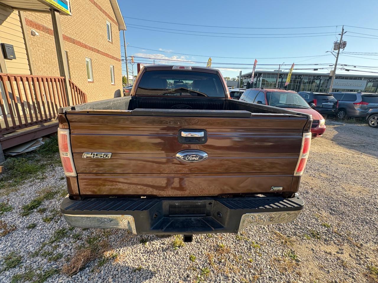 2011 Ford F-150 4WD SUPERCREW 145" XLT Photo