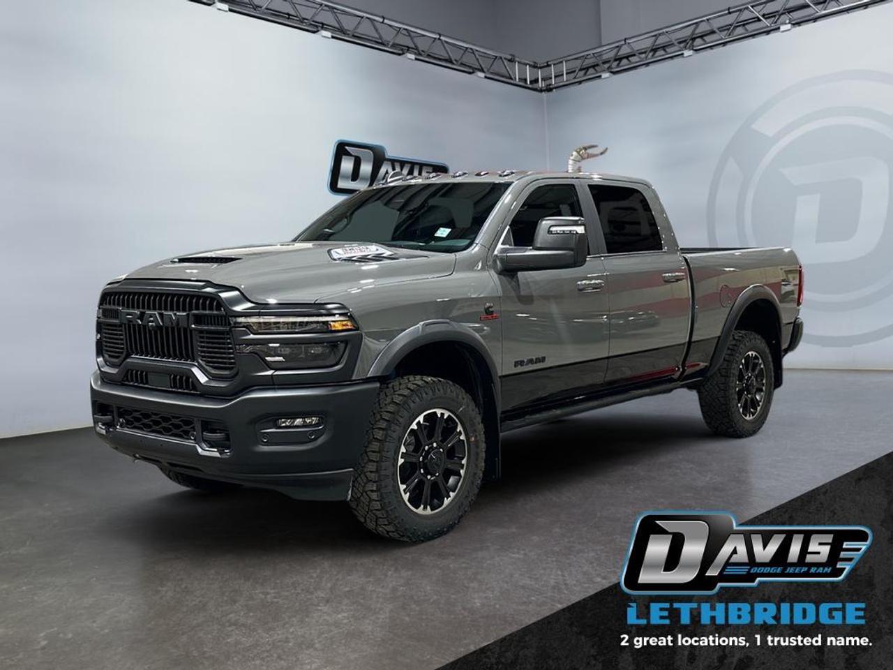 <b>Mopar Rock Rails, Navigation, Heated and Cooled Seats, Blind Spot Detection, Remote Start, Heated Steering Wheel!<br /> <br /></b><br /> <br /> <br />Conquer work sites and off-road trails with the 2026 Ram 2500 Rebel Crew Cab in Ceramic Gray with two-tone lower paint. Powered by a 6.7L Cummins Turbo Diesel I6 engine paired with an 8-speed TorqueFlite HD automatic transmission and 4x4 drivetrain, this truck delivers exceptional towing, payload, and off-road performance.<br /><br />Built for rugged adventure, it features Rebel Performance Suspension, 20 Black Diamond-Cut wheels, LT285/60R20 all-terrain tires, powder-coated bumpers, LED lighting, MOPAR rock rails, and a spray-in bedliner. The interior combines comfort and technology with leather-trimmed ventilated and heated bucket seats, full-length upgraded floor console, folding rear 60/40 seat, Uconnect 5 NAV with 12 touchscreen, Apple CarPlay, Android Auto, Alexa built-in, 9-speaker Alpine audio, and dual wireless charging.<br /><br />Safety and convenience include adaptive cruise control with stop, ParkView rear camera, ParkSense front/rear park assist, blind-spot monitoring with cross-path detection, Class V receiver hitch, tow hooks, trailer sway damping, and tip start. The 2026 Ram 2500 Rebel blends power, comfort, and advanced technology for work or adventure.<br /> <br />To apply right now for financing use this link: <a href=https://lethbridge.davisdodge.ca/free-credit-check/ target=_blank rel=nofollow noopener noreferrer>https://lethbridge.davisdodge.ca/free-credit-check/</a><br /><br /> <br /><br />As a premier Chrysler, Dodge, Jeep and RAM dealership, Davis Dodge proudly offers an extensive selection of new and used vehicles to meet every drivers needs. Customers across Lethbridge, Fort Macleod, Taber, Claresholm, Coaldale, and beyond trust us for daily vehicle specials, certified service and parts, and a seamless online inventory experience. <br /><br /> With competitive financing options and expert support, we make car buying easy and enjoyable. <br /><br /> Ready to hit the road? Schedule your test drive today at Davis Dodge, your trusted Chrysler, Dodge, Jeep and RAM dealer in Lethbridge, Alberta.<br /><br /> Vehicle pricing offer shown expires 2026-04-30. <br /> Come by and check out our fleet of 60+ used cars and trucks and 110+ new cars and trucks for sale in Lethbridge. o~o