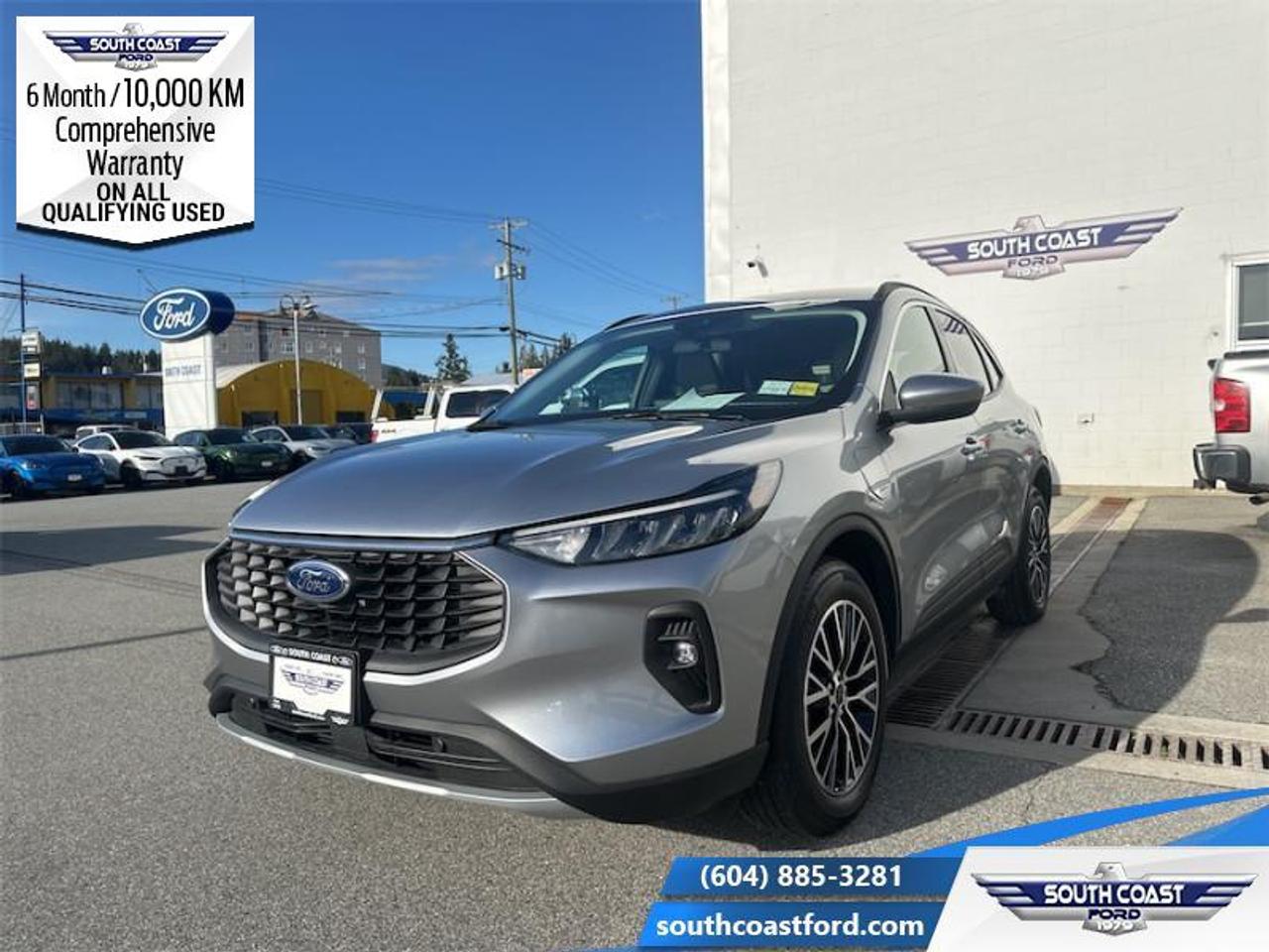 <b>Low Mileage, Hybrid!</b><br> <br> <p style=color:Blue;><b>Upgrade your ride at South Coast Ford with peace of mind! Our used vehicles come with a minimum of 10,000 km and 6 months of Comprehensive Vehicle Warranty. Drive with confidence knowing your investment is protected.</b></p><br> <br> Compare at $36990 - Our Price is just $35404! <br> <br>In the city or in the forest, this Ford Escape is built to get you over any terrain with confidence and comfort. This 2023 Ford Escape is for sale today in Sechelt. <br> <br>This Ford Escape was built for an active lifestyle and offers plenty of options for you to hit the road in your own individual style. Whether you need a family SUV for soccer practice, a capable adventure vehicle, or both, the versatile Ford Escape has you covered. Built for those who live on the go, the 2023 Ford Escape is made to be unstoppable. This low mileage SUV has just 7,011 km. Its Iconic Silver Metallic in colour and is completely accident free based on the <a href=https://vhr.carfax.ca/?id=NU7ofxAE7q+OMaD0oQvWyrNw0QJ62D9E target=_blank>CARFAX Report</a>. It has a CVT transmission and is powered by a 210HP 2.5L 4 Cylinder Engine. <br> <br> Our Escapes trim level is PHEV. With an extremely efficient yet potent plug-in hybrid powertrain with fast charging, this Escape PHEV features heated front seats with ActiveX synthetic leather upholstery, a heated leatherette steering wheel, adaptive cruise control, remote engine start, and an upgraded 13.2-inch infotainment system now with an integrated navigation system, along with wireless Apple CarPlay and Android Auto. Safety technology also receives an upgrade, with reverse parking sensors, intersection assist and evasive steering assist, along with blind spot monitoring, lane departure warning with lane keeping assist, front and rear collision mitigation, and driver monitoring alert. Additional features include power heated side mirrors, front fog lamps, roof rack rails, and so much more. This vehicle has been upgraded with the following features: Hybrid.<br> To view the original window sticker for this vehicle view this <a href=http://www.windowsticker.forddirect.com/windowsticker.pdf?vin=1FMCU0E18PUB04477 target=_blank>http://www.windowsticker.forddirect.com/windowsticker.pdf?vin=1FMCU0E18PUB04477</a>. <br/><br> <br>To apply right now for financing use this link: <a href=https://www.southcoastford.com/financing/ target=_blank>https://www.southcoastford.com/financing/</a><br><br> <br/><br> Buy this vehicle now for the lowest bi-weekly payment of <b>$289.56</b> with $0 down for 84 months @ 7.99% APR O.A.C. (All rates are OAC. Check with our team for rate specials on new and used vehicles. Banks will have financed minimum amounts for certain rates.     / Total Obligation of $48380  ).  See dealer for details. <br> <br>Call South Coast Ford Sales or come visit us in person. Were convenient to Sechelt, BC and located at 5606 Wharf Avenue. and look forward to helping you with your automotive needs.<br><br> Come by and check out our fleet of 20+ used cars and trucks and 90+ new cars and trucks for sale in Sechelt.  o~o