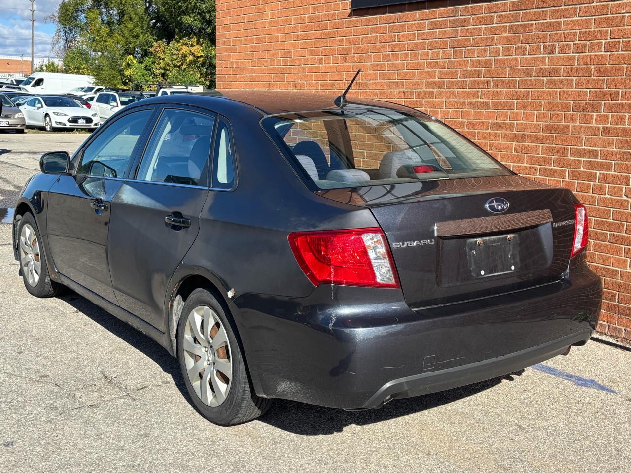 2009 Subaru Impreza 4dr Sdn Auto 2.5i Photo3