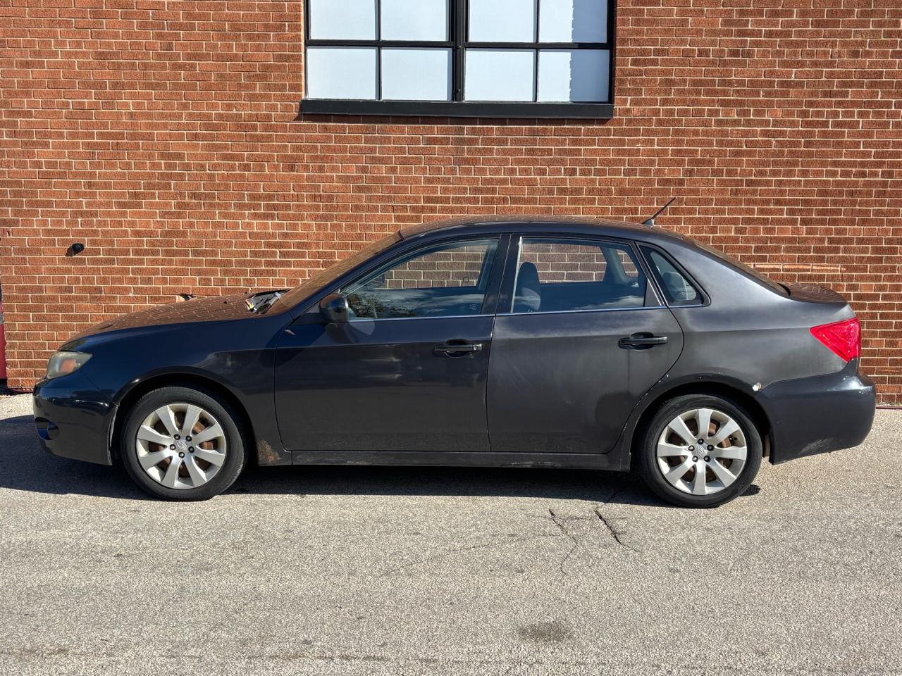2009 Subaru Impreza 4dr Sdn Auto 2.5i Photo2