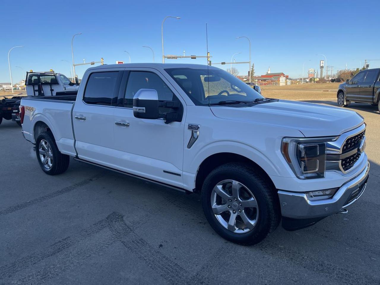 THE PRICE YOU SEE, PLUS GST. GUARANTEED!APPLE CARPLAY/ANDROID AUTO COMPATABLE! 3.5 LITER HYBRID, 10 SPEED AUTO, KING RANCH TRIM(601a), HEATED/VENTED FRONT SEATS, HEATED REAR SEATS, MAX TOW PKG, TWIN PANEL MOONROOF, SYNC 4 W 12 INFOTAINMENT.      The 2021 Ford F-150 King Ranch with the 3.5-liter PowerBoost hybrid engine and the 601A package is a premium full-size pickup that combines robust performance with luxury and advanced technology. The 3.5-liter PowerBoost hybrid V6 engine delivers a combined output of around 430 horsepower and 570 lb-ft of torque, offering impressive towing capacity, enhanced fuel efficiency, and a smooth, responsive driving experience. The King Ranch trim is renowned for its distinctive Western-themed interior, featuring premium leather upholstery, wood accents, and a luxurious, spacious cabin designed for comfort on both work and leisure trips. The 601A package elevates this model further with a host of upscale features, including a large 12-inch touchscreen infotainment system with SYNC 4, navigation, a premium Bang & Olufsen audio system, and a digital instrument cluster. It also adds convenience and safety features such as a 360-degree camera system, adaptive cruise control, blind-spot monitoring, and a power tailgate. Overall, the 2021 Ford F-150 King Ranch with the hybrid engine and 601A package offers a perfect blend of power, efficiency, luxury, and cutting-edge technology, making it an ideal choice for those needing a capable workhorse with premium amenities.Do you want to know more about this vehicle, CALL, CLICK OR COME ON IN!*AMVIC Licensed Dealer; CarFax and Full Mechanical Inspection Included.