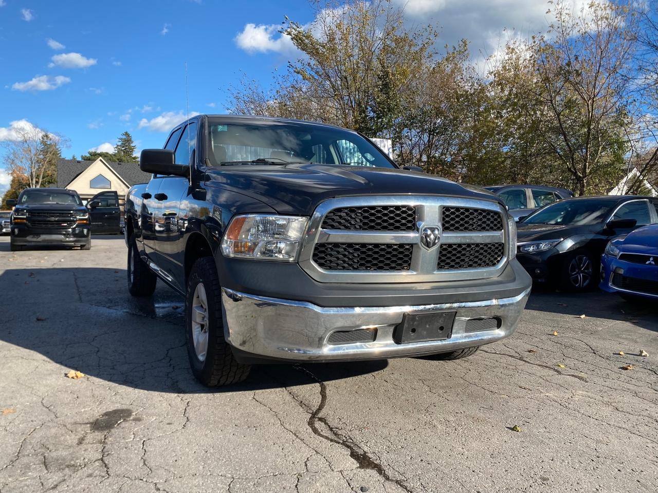 Used 2015 RAM 1500 4WD QUAD CAB 140.5