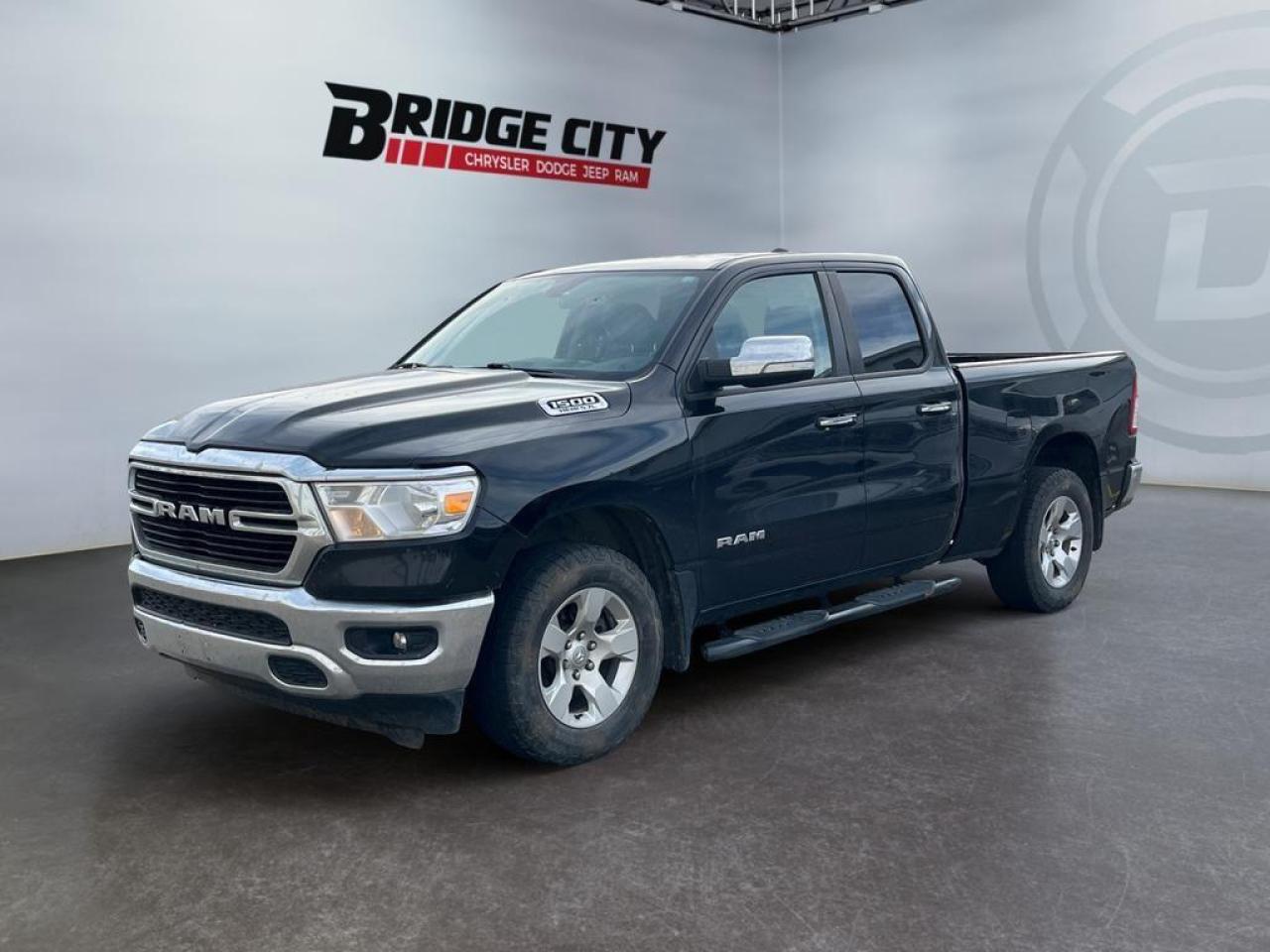<b>Aluminum Wheels, Chrome Accents, Proximity Key, Touchscreen, Streaming Audio!</b><br /> <br /> Fully redesigned for 2019, this Ram 1500 has reduced weight and increased payload and towing capacity over the previous generations. This 2019 Ram 1500 is fresh on our lot in Lethbridge. <br /> <br />The Ram 1500 delivers power and performance everywhere you need it, with a tech-forward cabin that is all about comfort and convenience. Loaded with best-in-class features, it's easy to see why the Ram 1500 is so popular. With the most towing and hauling capability in a Ram 1500, as well as improved efficiency and exceptional capability, this truck has the grit to take on any task. This Quad Cab 4X4 pickup has 212,500 kms. Stock number 40745 is black in colour . It has an automatic transmission and is powered by a 395HP 5.7L 8 Cylinder Engine. <br /> <br /> Our 1500's trim level is Big Horn. This Ram 1500 Big Horn comes very well equipped with stylish aluminum wheels, comfortable cloth seats and premium carpet floors, a leather steering wheel, Uconnect with a larger touchscreen, wireless streaming audio, USB and aux input jacks, and a useful rear view camera. This awesome pickup truck also includes power heated side mirrors, proximity keyless entry, cruise control, an HD suspension, towing equipment, chrome bumpers with rear step, chrome exterior accents, fog lights and much more. This vehicle has been upgraded with the following features: Aluminum Wheels, Chrome Accents, Proximity Key, Touchscreen, Streaming Audio, Rear Camera, Cruise Control. <br /> <br />To apply right now for financing use this link : <a href=https://www.bridgecitychrysler.com/pre-approval/ target=_blank rel=nofollow noopener noreferrer>https://www.bridgecitychrysler.com/pre-approval/</a><br /><br /> <br /><br />Locally Owned & Trusted for Over 35 Years  Bridge City Chrysler in Lethbridge, AB <br /><br /> At Bridge City Chrysler, weve proudly served the Lethbridge community for more than 35 years, offering an unparalleled car buying experience. Dont just take our word for itour Google reviews speak volumes about our commitment to exceptional service. <br /><br /> Delivery & At-Home Test Drives: Convenient options to suit your lifestyle. <br /><br /> Flexible Financing for Everyone: Get the vehicle you need with financing solutions tailored to your situation. <br /><br /> Full Mechanical Inspections & Professional Cleaning: Every vehicle is thoroughly inspected and cleaned before it hits our lot.<br /><br /> We take all makes and models on trade and offer competitive pricing with inventory that changes daily. Whether you're shopping for a Chrysler, Dodge, Jeep, RAM, or FIAT, our AMVIC Licensed dealership makes it easy to browse, buy, and drive away.<br /><br /> Located in Lethbridge, AB, we proudly serve customers in Fort Macleod, Taber, Claresholm, and Coaldale. Shop online or visit us today to experience the best in sales, service, and selection. Standard bank rates apply; taxes are additional.<br /><br /> Vehicle pricing offer shown expire 2025-11-30. <br /> Come by and check out our fleet of 110+ used cars and trucks and 130+ new cars and trucks for sale in Lethbridge. o~o