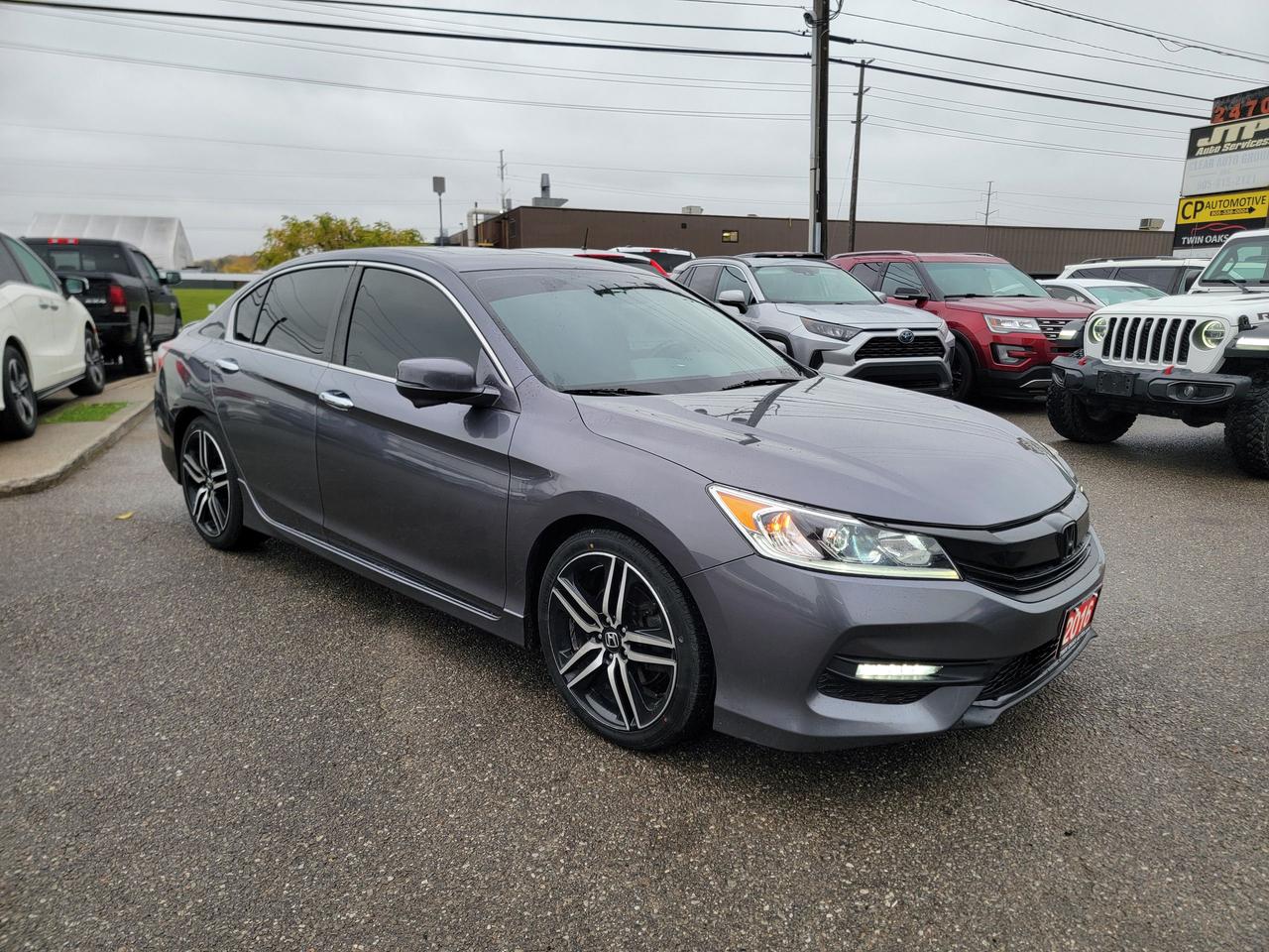 <p data-start=156 data-end=183><strong data-start=156 data-end=183>2016 Honda Accord Sport</strong></p><p data-start=185 data-end=519>This 2016 Honda Accord Sport strikes the perfect balance between sophistication and performance. With its bold styling, spacious interior, and legendary Honda reliability, it&rsquo;s no surprise the Accord remains one of Canada&rsquo;s most trusted sedans. The Sport trim adds sharper looks and a more engaging drive, making every trip enjoyable.</p><p data-start=521 data-end=539><strong data-start=521 data-end=537>Key Features</strong></p><ul data-start=540 data-end=1220><li data-start=540 data-end=582><p data-start=542 data-end=582>2.4L i-VTEC 4-cylinder engine &ndash; 189 hp</p></li><li data-start=583 data-end=636><p data-start=585 data-end=636>CVT automatic with paddle shifters and Sport mode</p></li><li data-start=637 data-end=658><p data-start=639 data-end=658>Front-wheel drive</p></li><li data-start=659 data-end=702><p data-start=661 data-end=702>19&rdquo; alloy wheels with performance tires</p></li><li data-start=703 data-end=736><p data-start=705 data-end=736>Dual chrome exhaust finishers</p></li><li data-start=737 data-end=780><p data-start=739 data-end=780>Power driver&rsquo;s seat with lumbar support</p></li><li data-start=781 data-end=803><p data-start=783 data-end=803>Heated front seats</p></li><li data-start=804 data-end=853><p data-start=806 data-end=853>Leather-wrapped steering wheel and shift knob</p></li><li data-start=854 data-end=893><p data-start=856 data-end=893>Dual-zone automatic climate control</p></li><li data-start=894 data-end=938><p data-start=896 data-end=938>Bluetooth hands-free and audio streaming</p></li><li data-start=939 data-end=985><p data-start=941 data-end=985>8&rdquo; infotainment display with backup camera</p></li><li data-start=986 data-end=1038><p data-start=988 data-end=1038>Steering-wheel mounted audio and cruise controls</p></li><li data-start=1039 data-end=1078><p data-start=1041 data-end=1078>Keyless entry and push-button start</p></li><li data-start=1079 data-end=1124><p data-start=1081 data-end=1124>LED daytime running lights and fog lights</p></li><li data-start=1125 data-end=1167><p data-start=1127 data-end=1167>Rear-view camera with multi-angle view</p></li><li data-start=1168 data-end=1220><p data-start=1170 data-end=1220>Fold-down rear seats for added cargo versatility</p></li><li data-start=1168 data-end=1220><p data-start=1170 data-end=1220>Clean, well-kept example of Honda&rsquo;s popular mid-size sedan. Known for its smooth ride, roomy interior, and excellent fuel economy, the Accord Sport also delivers a sportier edge with its upgraded styling and responsive handling.</p></li><li data-start=1168 data-end=1220><p data-start=1170 data-end=1220>Whether commuting daily or heading out on weekend trips, this Accord Sport blends comfort, efficiency, and reliability in one sleek package. A solid, stylish choice that&rsquo;s ready to drive and enjoy.</p></li></ul><p><strong>Additional Certification Cost</strong>: The full certification cost for this vehicle is <strong>$790 + HST</strong>.</p><p><strong>What&rsquo;s Included with Certification</strong>:</p><ul><li>The vehicle will be delivered with a <strong>valid safety certification</strong> and a <strong>36-day safety item warranty</strong> for your peace of mind.</li><li>A <strong>fresh oil change</strong> will be performed, and all fluids will be topped up.</li><li>The vehicle will be <strong>professionally detailed</strong>, ensuring it looks and feels like new when you pick it up.</li></ul><p>At <strong>Twin Oaks Auto</strong>, we are committed to providing a <strong>hassle-free car buying experience</strong>. From your first inquiry to driving off in your new car, our goal is to get you on the road quickly and stress-free!</p><p><strong>Financing Options Available!</strong><br>Flexible financing options are available to suit your needs. Contact us for more details.</p><p><strong>Contact Us Today</strong>:<br>📞 <strong>Call Us</strong>: 905-339-3330<br>📍 <strong>Location</strong>: 2470 Royal Windsor Drive, Oakville, Ontario, L6J 7Y2</p><p><br>(Conveniently located between Ford Drive and Winston Churchill Blvd.)</p><p><strong>More Information</strong>:<br>Visit our website at <strong><a href=http://www.twinoaksauto.com>TwinOaksAuto.com</a></strong> to view additional pictures, explore our inventory, and access CARFAX reports.</p><p>&nbsp;</p>