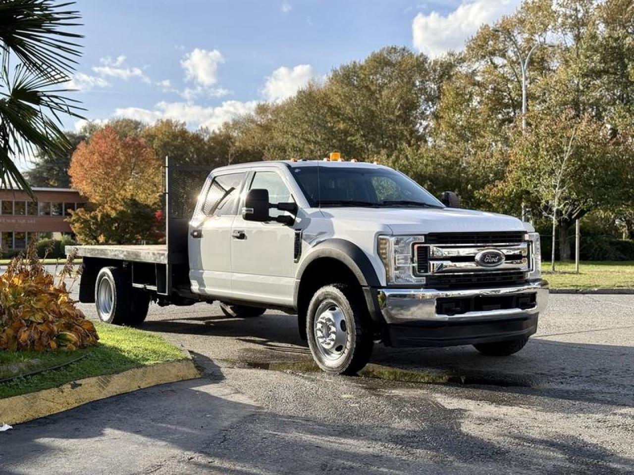 Used 2019 Ford F-550 XLT 4X4 12-Foot Flat Deck Truck for sale in Burnaby, BC