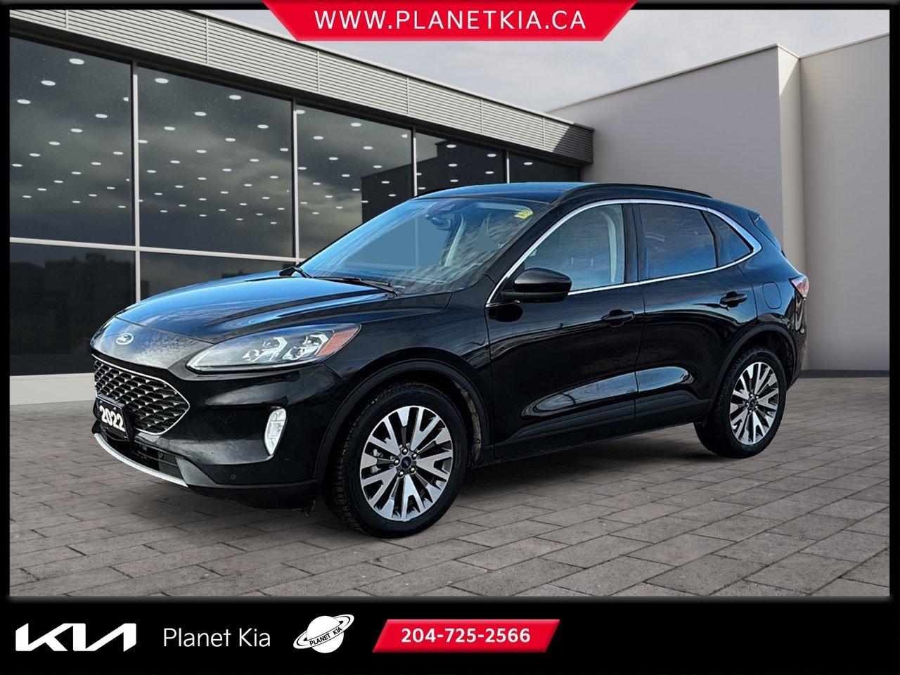 <p data-start=0 data-end=75><strong data-start=0 data-end=73>2022 Ford Escape Titanium for Sale at Planet Kia in Brandon, Manitoba</strong>

<p data-start=77 data-end=430>Experience refined comfort, advanced technology, and confident performance in the <strong data-start=159 data-end=188>2022 Ford Escape Titanium</strong>, available now at <strong data-start=207 data-end=242>Planet Kia in Brandon, Manitoba</strong>. This top-tier trim blends modern design, intelligent features, and exceptional efficiency &mdash; making it a perfect fit for Manitoba drivers seeking style and versatility in one sleek SUV.

<hr data-start=432 data-end=435 />
<h3 data-start=437 data-end=471><strong data-start=441 data-end=469>Performance & Efficiency</strong></h3>
<p data-start=472 data-end=909>The 2022 Escape Titanium features a <strong data-start=508 data-end=532>2.0L EcoBoost engine</strong> paired with an <strong data-start=548 data-end=582>8-speed automatic transmission</strong> for smooth, responsive power. With <strong data-start=618 data-end=655>intelligent all-wheel drive (AWD)</strong> and <strong data-start=660 data-end=686>Selectable Drive Modes</strong>, you&rsquo;ll feel confident on Brandon&rsquo;s snowy streets or while cruising Manitoba highways. The available <strong data-start=788 data-end=818>Auto Start-Stop Technology</strong> and <strong data-start=823 data-end=843>Eco driving mode</strong> help maximize fuel efficiency without compromising performance.

<hr data-start=911 data-end=914 />
<h3 data-start=916 data-end=952><strong data-start=920 data-end=950>Premium Interior & Comfort</strong></h3>
<p data-start=953 data-end=1287>Step inside a cabin designed for modern comfort and sophistication. The Titanium trim offers <strong data-start=1046 data-end=1073>leather-trimmed seating</strong>, <strong data-start=1075 data-end=1097>heated front seats</strong>, <strong data-start=1099 data-end=1135>a power-adjustable driver&rsquo;s seat</strong>, and <strong data-start=1141 data-end=1170>dual-zone climate control</strong>. Enjoy open-air freedom with the <strong data-start=1204 data-end=1229>panoramic Vista Roof&reg;</strong>, while ambient interior lighting adds an upscale touch.

<p data-start=1289 data-end=1553>Stay connected with the <strong data-start=1313 data-end=1344>SYNC&reg; 3 infotainment system</strong>, featuring a <strong data-start=1358 data-end=1379>large touchscreen</strong>, <strong data-start=1381 data-end=1411>voice-activated navigation</strong>, and <strong data-start=1417 data-end=1462>wireless Apple CarPlay&reg; and Android Auto&trade;</strong>. Plus, the <strong data-start=1474 data-end=1502>premium B&O sound system</strong> delivers crisp, immersive audio for every drive.

<hr data-start=1555 data-end=1558 />
<h3 data-start=1560 data-end=1602><strong data-start=1564 data-end=1600>Smart Safety & Driver Assistance</strong></h3>
<p data-start=1603 data-end=1735>The 2022 Escape Titanium comes equipped with <strong data-start=1648 data-end=1677>Ford Co-Pilot360&trade; Assist+</strong>, offering advanced features that make every trip safer:

<ul data-start=1736 data-end=2005>
<li data-start=1736 data-end=1782>
<p data-start=1738 data-end=1782><strong data-start=1738 data-end=1780>Adaptive Cruise Control with Stop & Go</strong>

</li>
<li data-start=1783 data-end=1810>
<p data-start=1785 data-end=1810><strong data-start=1785 data-end=1808>Lane-Keeping System</strong>

</li>
<li data-start=1811 data-end=1880>
<p data-start=1813 data-end=1880><strong data-start=1813 data-end=1853>Blind Spot Information System (BLIS)</strong> with Cross-Traffic Alert

</li>
<li data-start=1881 data-end=1912>
<p data-start=1883 data-end=1912><strong data-start=1883 data-end=1910>Evasive Steering Assist</strong>

</li>
<li data-start=1913 data-end=1974>
<p data-start=1915 data-end=1974><strong data-start=1915 data-end=1972>Pre-Collision Assist with Automatic Emergency Braking</strong>

</li>
<li data-start=1975 data-end=2005>
<p data-start=1977 data-end=2005><strong data-start=1977 data-end=2003>Active Park Assist 2.0</strong>

</li>
</ul>
<p data-start=2007 data-end=2124>With these technologies, you&rsquo;ll enjoy peace of mind whether commuting through Brandon or traveling across Manitoba.

<hr data-start=2126 data-end=2129 />
<h3 data-start=2131 data-end=2169><strong data-start=2135 data-end=2167>Exterior Design & Highlights</strong></h3>
<p data-start=2170 data-end=2444>The Titanium trim stands out with <strong data-start=2204 data-end=2240>19-inch machined aluminum wheels</strong>, <strong data-start=2242 data-end=2260>chrome accents</strong>, <strong data-start=2262 data-end=2288>LED signature lighting</strong>, and <strong data-start=2294 data-end=2325>a hands-free power liftgate</strong>. Its aerodynamic lines and confident stance give it a modern, athletic look that commands attention wherever you go.

<hr data-start=2446 data-end=2449 />
<h3 data-start=2451 data-end=2479><strong data-start=2455 data-end=2477>Feature Highlights</strong></h3>
<ul data-start=2480 data-end=2703>
<li data-start=2480 data-end=2513>
<p data-start=2482 data-end=2513>2.0L EcoBoost engine with AWD

</li>
<li data-start=2514 data-end=2559>
<p data-start=2516 data-end=2559>SYNC&reg; 3 with navigation and voice control

</li>
<li data-start=2560 data-end=2588>
<p data-start=2562 data-end=2588>B&O premium audio system

</li>
<li data-start=2589 data-end=2630>
<p data-start=2591 data-end=2630>Heated leather seats & panoramic roof

</li>
<li data-start=2631 data-end=2673>
<p data-start=2633 data-end=2673>Ford Co-Pilot360&trade; Assist+ safety suite

</li>
<li data-start=2674 data-end=2703>
<p data-start=2676 data-end=2703>Hands-free power liftgate

</li>
</ul>
<hr data-start=2705 data-end=2708 />
<h3 data-start=2710 data-end=2788><strong data-start=2714 data-end=2786>Test Drive the 2022 Ford Escape Titanium at Planet Kia in Brandon MB</strong></h3>
<p data-start=2789 data-end=3065>If you&rsquo;re searching for a <strong data-start=2815 data-end=2852>2022 Ford Escape Titanium near me</strong>, visit <strong data-start=2860 data-end=2895>Planet Kia in Brandon, Manitoba</strong> today. We proudly serve drivers from <strong data-start=2933 data-end=2994>Brandon, Neepawa, Carberry, and across Southwest Manitoba</strong>, offering premium pre-owned SUVs and friendly, professional service.

<p data-start=3067 data-end=3220>Take the <strong data-start=3076 data-end=3105>2022 Ford Escape Titanium</strong> for a test drive and experience how luxury and performance come together &mdash; only at <strong data-start=3189 data-end=3217>Planet Kia in Brandon MB</strong>.

<p data-start=3222 data-end=3285><strong data-start=3222 data-end=3283>Planet Kia &mdash; where great vehicles and great service meet</strong>







Planet Kia is thrilled to be Brandon Manitoba&rsquo;s Preowned Kia Superstore! With tons of vehicles on ground including Nissan, Toyota, Honda, Acura, Volkswagen, Subaru, Hyundai, Mitsubishi, Kia, Ford, Dodge, Chevrolet, GMC with at least 50% being pre-owned Kia&rsquo;s, we will find the right vehicle for you.&nbsp;



New to Canada? Bad credit? No credit?&nbsp;



At Planet Kia we have a 99% approval rate, regardless of your credit situation we can get you approved on a new or used vehicle, if we can&rsquo;t do it then no one can!&nbsp;




We are proud to be the locally owned and operated, Come in and see why consumers are choosing Planet Kia.




Dealer Permit # 2824